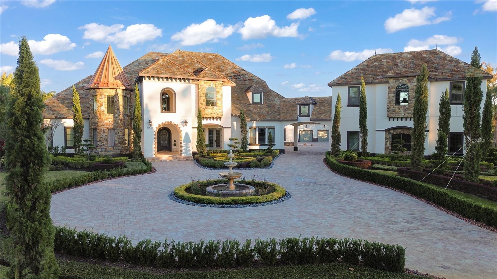 Back on the market and ready to move! This stunning estate in the highly sought-after Stonelake Ranch community offers luxury, space, and privacy on 7.5 acres. Previous contract fell through—giving you a rare second chance at a truly exceptional property.

Experience exceptional luxury living at 10641 Broadland Pass, an architectural masterpiece set on 7.5 private acres within the prestigious, guard-gated community of Stonelake Ranch—one of Tampa Bay’s most sought-after luxury enclaves. Designed for the discerning buyer seeking privacy, scale, and timeless craftsmanship, this extraordinary estate offers more than 8,300 square feet of elevated living space surrounded by natural beauty and resort-style amenities.

A long paver, tree-lined driveway creates a breathtaking first impression, guiding you toward a residence defined by its fine stone, wood, and metal detailing, European-inspired design, and commanding curb appeal. Inside, a grand foyer welcomes you with soaring ceilings, abundant natural light, and rich architectural finishes that carry throughout the home. Every room has been designed with intention—balancing elegance, function, and warm livability.

The expansive main living areas include a sophisticated formal living room, an impressive dining space, and a luxury chef’s kitchen featuring premium appliances, an oversized island, custom cabinetry, and seamless connection to the spacious family room. Perfect for both intimate gatherings and large-scale entertaining, the home’s open layout flows effortlessly while maintaining distinct spaces for relaxation and hosting.

The primary suite is a true retreat, offering peaceful views of the surrounding landscape, an oversized layout, and a spa-inspired bathroom with elevated finishes. Multiple guest suites, additional bedrooms, and a collection of flexible bonus rooms—including an executive office, media room, and recreation space—provide comfort and privacy for family, guests, and extended stays.

Step outside and experience the essence of Florida luxury living. With more than seven acres of tranquil land, the property presents endless possibilities—from elegant outdoor entertaining to creating your own private resort environment. The acreage is ideal for customizing additional outdoor living features, gardens, or leisure spaces tailored to your lifestyle.

Located in the exclusive Stonelake Ranch, residents enjoy an unmatched suite of community amenities: a private clubhouse, fitness center, miles of equestrian trails, basketball court, Lakeside Park, and direct access to Lake Thonotosassa, one of the area’s largest recreational lakes—perfect for boating, paddleboarding, and sunset waterfront gatherings. This rare combination of luxury, acreage, and amenities makes the community one of the most desirable in the Tampa region.

All of this is just a short drive from downtown Tampa, major hospitals, top-tier schools, Bruce B. Downs, North Tampa, New Tampa, Brandon, and Tampa International Airport—offering the perfect blend of serenity, accessibility, and prestige.

10641 Broadland Pass is more than a residence—it is a grand estate, a private sanctuary, and an extraordinary lifestyle opportunity in one of Tampa Bay’s premier luxury communities. Properties of this scale and craftsmanship rarely come available
