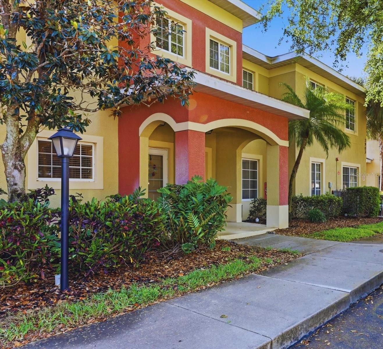 Discover a charming townhouse in the heart of Bradenton, nestled within the nice gated community of Lakeside Village. This beautiful townhouse features 2 well-appointed bedrooms, a versatile study/den, 2 full bathrooms, and an additional guest bathroom, all designed with comfort and style in mind. Upon entry, you are greeted by a thoughtfully designed floor plan that flows seamlessly throughout the space. The expansive dining room and living room invite entertaining and relaxation, while the second floor offers a private retreat with the master suite, second bedroom, and study/den thoughtfully arranged for tranquility. Recently painted, the interior radiates a fresh and inviting atmosphere. Step onto the serene lanai and indulge in your morning coffee as you overlook the picturesque lake and lush natural surroundings.  Built in 2008, this sturdy townhouse adheres to the latest design standards, boasting hurricane-resistant windows and fire sprinklers for your safety and peace of mind. The modern HVAC system ensures optimal comfort throughout the seasons. Constructed entirely of block, this home offers durability and sound insulation, with two stories of solid walls separating each unit. The tranquil lake in your backyard enhances the ambiance, creating an idyllic setting for relaxation. With ample guest parking available, Lakeside Village is ideally located near an array of fine dining, shopping, and just a short drive from the stunning Anna Maria Island along with other breathtaking beaches and entertainment options. The close proximity to IMG further elevates this desirable location. This remarkable townhouse is a rare find that won’t last long..