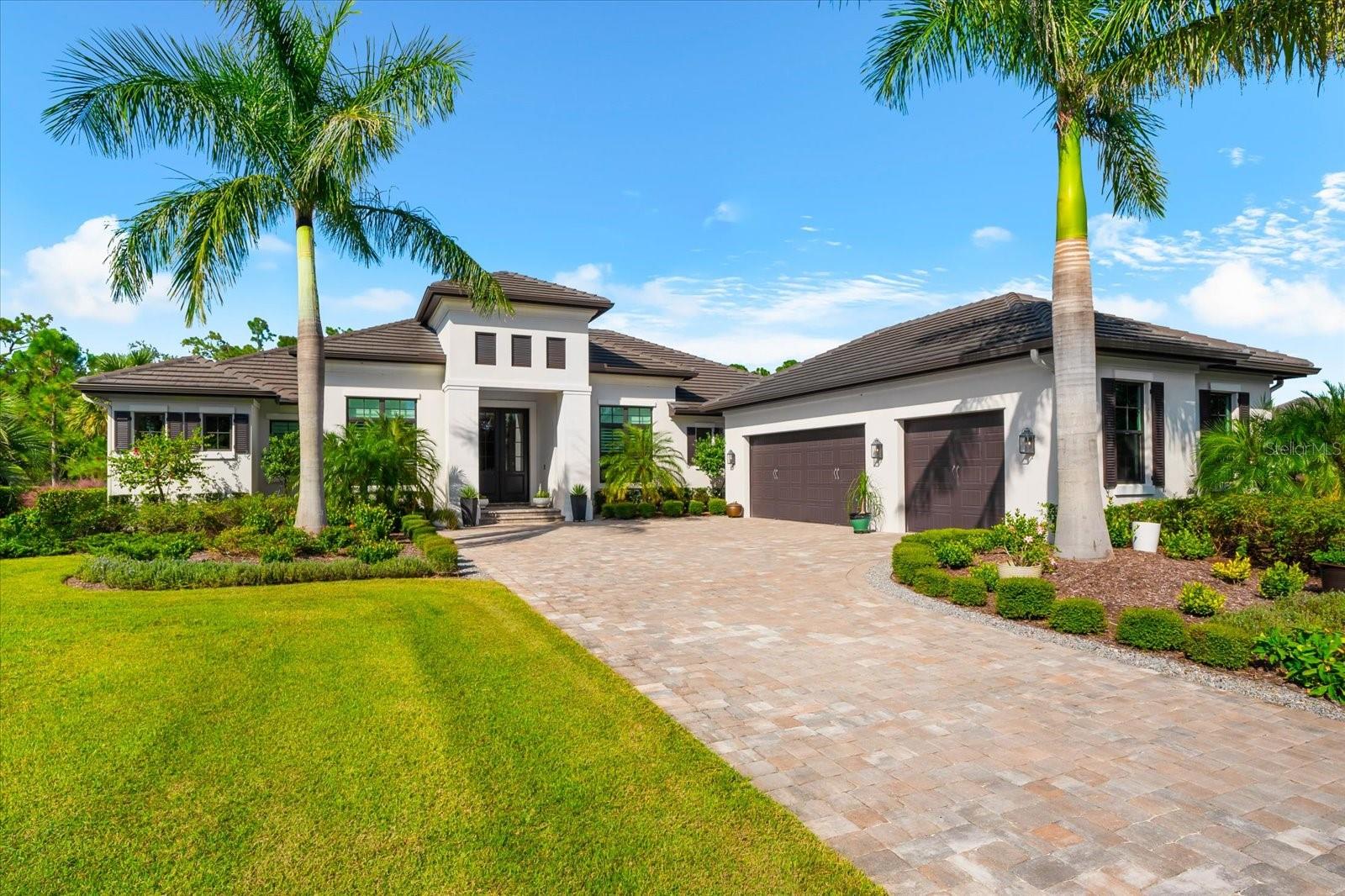 A Rare Opportunity in The Concession – Former Anchor Builders Model. Why wait to build when you can move right into this award-winning, professionally decorated and fully furnished former model home? Winner of the 2021 Parade of Homes for Best Overall Home and Certified Green Home, this Anchor Builders’ masterpiece blends the highest level of quality and timeless craftsmanship with modern luxury, all set on a private one-acre homesite in the prestigious Concession. From the moment you arrive, the grand driveway and stone-columned entry create an unforgettable first impression. Step inside to soaring ceilings, walls of impact glass, oak floors, and architectural details that showcase the extraordinary level of finish. At the heart of the home, an open great room with a dramatic stone fireplace flows seamlessly into the chef’s kitchen equipped with Sub-Zero, Wolf, and Cove appliances, quartz counters, a large center island, raised panel custom cabinetry, and butler’s pantry. Every detail is designed for entertaining and effortless living. Relax in the primary suite, a spa-like retreat featuring a stand-alone tub, oversized shower, dual vanities with custom cabinetry, two walk-in closets with built-ins, and serene pool views. Three additional en-suite bedrooms each offer their own private sanctuary, complete with designer bathrooms and walk-in closets with custom shelving. Work from home in the office/den, complete with custom built-in shelves and a desk, offering both functionality and elegance. A versatile bonus room serves as a favorite gathering spot, with corner sliding doors that open to the outdoor lanai, perfect for entertainment, media, or play. But the true showstopper is outside. The expansive lanai is a resort all its own, complete with outdoor kitchen, fire pit, cypress wood ceilings, custom cypress cabinetry, leathered marble pavers, saltwater pool with sun shelf, and spa. Imagine evenings by the fire, weekend gatherings around the grill, and quiet mornings overlooking your private, wooded view. Smart home technology, energy-efficient insulation, custom window treatments, plantation shutters, and even a climate-controlled interior storage room ensure this residence is as functional as it is beautiful.  Exquisite and meticulously maintained, this home enjoys an ideal location within The Concession, a gated community known for its privacy, serene natural beauty, and spacious estate homesites. Meticulously maintained and elegantly furnished, this is more than a home, it’s a statement of style, comfort, and luxury. Few properties offer this level of design, privacy, and lifestyle. Opportunities of this caliber within The Concession are exceedingly rare; experience a residence that truly stands apart.