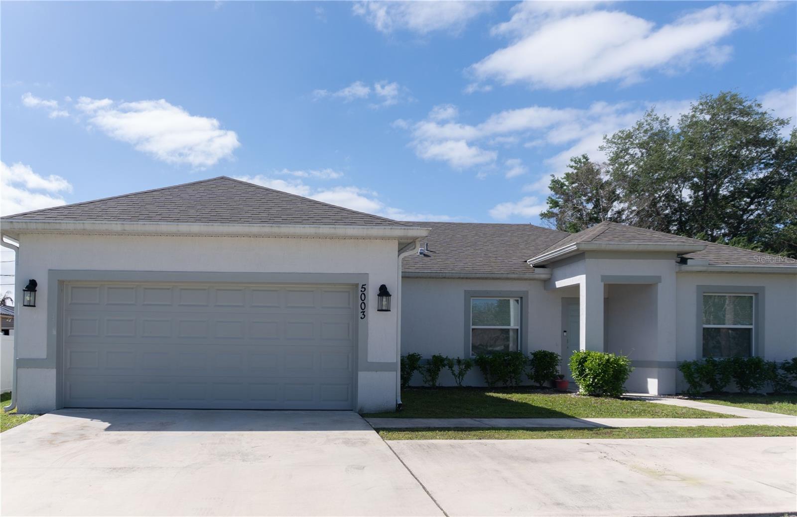 Discover this well-maintained, newer construction home located in a quiet residential area of Port St. Lucie with no HOA restrictions. Built in 2022, this single-story residence offers a practical and comfortable layout with 3 bedrooms and 2 full bathrooms, ideal for both primary homeowners and investors. Inside, the home features a bright and open living space designed for everyday functionality, with a seamless flow between the kitchen, dining, and main living areas. The kitchen provides ample cabinetry and workspace, making it easy to entertain or enjoy family meals. The split-bedroom floor plan offers privacy, with a spacious primary suite that includes a private bathroom and generous closet space. Additional bedrooms are well-sized and versatile for guests, home office, or growing households. Situated on an oversized lot of approximately 9,800 square feet, the property offers plenty of outdoor space with room to customize—whether for a future pool, outdoor living area, or additional landscaping. Conveniently located near major roadways, schools, shopping centers, and just a short drive to the Treasure Coast beaches, this home combines modern construction with everyday convenience in one of Port St. Lucie’s growing areas.