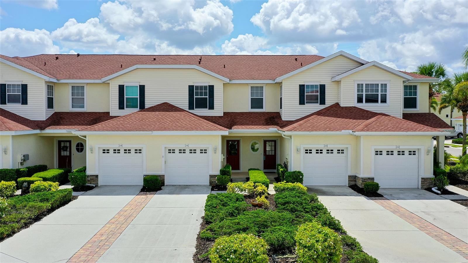 Townhome in The Towns at Lakeside! Welcome to this updated 2-story townhome in The Towns at Lakeside — ideal as a second home, investment, or full-time residence. Features new granite countertops in the kitchen and all bathrooms, stainless steel appliances (updated 2022), and luxury vinyl plank flooring throughout. The second floor hosts the bedrooms including a primary suite with private bath and a convenient washer/dryer on the bedroom level. Ground level includes an attached garage with extra storage and a screened back lanai for outdoor entertaining. Bathrooms feature ceramic tile. Community amenities include a 6,000 sq ft clubhouse, Olympic-sized pool and spa, fitness center, billiard room, library, basketball, tennis courts and pickleball courts. Close to Gulf Coast beaches, golf courses, dining and recreation. Serene setting with mature trees and landscaping, and easy freeway access.