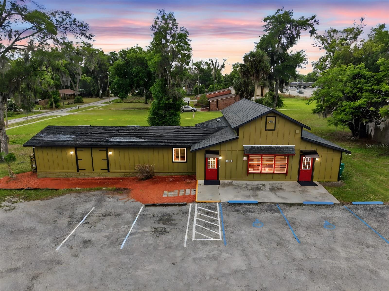 JUST REDUCED $50,000!.  PRICED TO SELL!!Unique mixed-use opportunity in DeLand on a prominent corner lot of approximately .65 acre, featuring two separate buildings and exceptional potential for owner-users, investors, or entrepreneurs. The main commercial building offers approximately 2,400 square feet of heated and cooled space and is currently home to an operating business. Recent seller improvements have enhanced the property’s curb appeal and presentation, including replacement of exterior wood rot, fresh exterior paint, all new doors, new awnings, new exterior decking, and freshly painted parking lines to clearly define parking spaces. The result is an inviting and well-presented commercial space ready for its next chapter.

Inside, the flexible floor plan offers a wide range of possibilities. The layout currently includes a large open area for business operations, a spacious meeting or conference room, 5 to 6 potential private offices, a kitchen, and several additional rooms that can be tailored to fit your needs. Whether you envision professional offices, studio space, wellness services, retail, or another commercial use, this versatile building can accommodate a variety of business models.

The second building is a block single-family residence featuring 2 bedrooms, 1 bath, and a screened porch. The seller has also prepared this home for sale, creating even more options for use and income potential.

Live in the residence while operating your business next door, rent the home to help offset expenses, or lease both buildings for investment income. Opportunities like this are rare. Schedule your private showing and explore the possibilities for yourself.