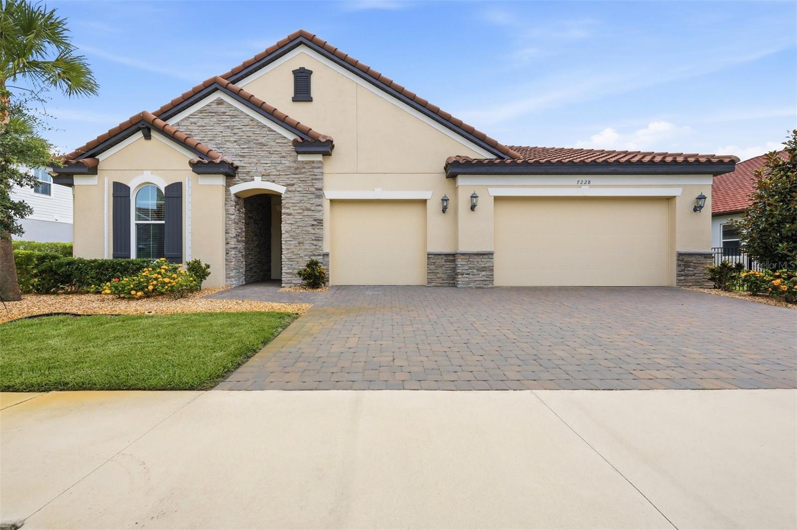 Welcome to this beautifully designed Ashwood model by Meritage Homes, nestled in the gated community of Heron Landing in Sarasota. Built in 2022, this expansive single-story home offers 4 bedrooms, 3 bathrooms, and over 3,300 square feet of thoughtfully crafted living space. As you enter you are greeted with high ceilings, ALL NEW wood look tile floors and an open, light filled floor plan - perfect for entertaining or everyday living. There is a perfectly positioned office with double doors that can also be used as a playroom, fitness area or with the addition of a closet an extra bedroom. The spacious great room has a wall of sliding glass doors that frame your large yard with serene lake views, and is open to the stunning kitchen and breakfast nook. The kitchen is complete with a large island, upgraded cabinetry, stainless steel appliances, a walk-in pantry, built in coffee bar and opens to the separate formal dining room. The three guest rooms are all perfectly appointed; one is in the front of the home with a full bathroom and the other two are located on the opposite side of the home and share a large bathroom. Retreat to the primary suite boasting views of the lake, a large tray ceiling and en-suite with dual sinks and oversized zero entry shower the perfect place to unwind at the end of the day. Every detail has been considered with a large inside laundry room, mudroom for additional storage, a three-car garage complete with an electric vehicle charger pre-wire and more. Step outside to the extended private covered patio and enjoy peaceful views. If you envision a pool in your backyard, this home has been prewired for a pool and spa; create your own personal oasis with the perfect backdrop. This location is ideally located less than 2 miles from I-75, a short drive to the world-renowned beach of Siesta Key and the vibrant arts, culture and dining of downtown Sarasota. With low HOA fees, no CDD fees and positioned in an A rated school district this home truly blends comfort and convenience.