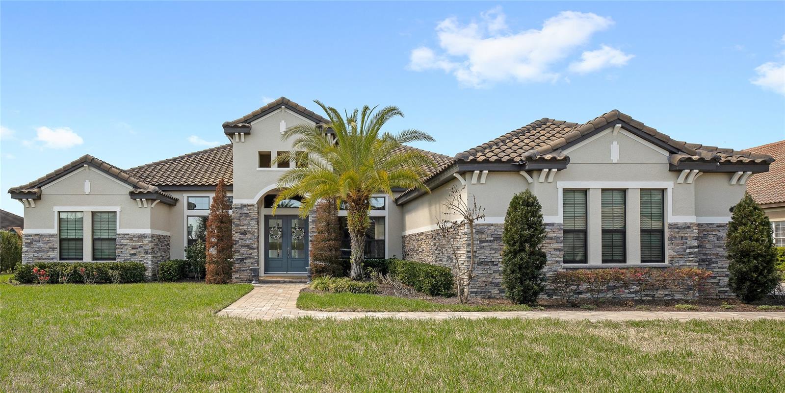Welcome to 25620 Grandview Pointe! This home is custom-built, never-before-listed, and sits on a golf-front homesite in the gated community of RedTail. Situated on over half an acre with sweeping views of the 5th and 10th holes, this home features incredible finishes and a prime cul-de-sac location. Inside, you are greeted with 12-ft ceilings and 14-ft tray details, 8-ft doors, custom lighting, and detailed trim. All of the features are complemented by upgraded hardwood flooring and floor-to-ceiling windows that fill the home with natural light. The 3-way split floor plan offers 4 spacious bedrooms, 4 full bathrooms, a dedicated office, and a media room. The gourmet kitchen features a unique curved island, timeless wood cabinetry, upgraded quartz countertops, stainless steel appliances, upgraded gas cooktop, and a butler’s pantry. This home also offers a 4-car garage, a stand out feature, which is rare in the RedTail community. The garage includes taller doors and high ceilings for easy storage of vehicles and equipment. The rear of the home includes a large lanai overlooking the golf course, offering direct sunset views and privacy. The golf cart path is set far back from the rear of the home, unlike many homesites in the community. The lot is oversized, flat and offers plenty of space for a future pool. RedTail offers an incredible lifestyle and location. Located only minutes from the 429 Expressway, just 15 minutes to Downtown Mount Dora, and with the Wekiva Parkway extension fully open, commuting to Lake Mary and I-4 takes only 15 minutes.
Don’t miss your opportunity to own this luxury RedTail estate with a golf course views, an oversized homesite and a private cul-de-sac location. Call today to schedule your private tour.