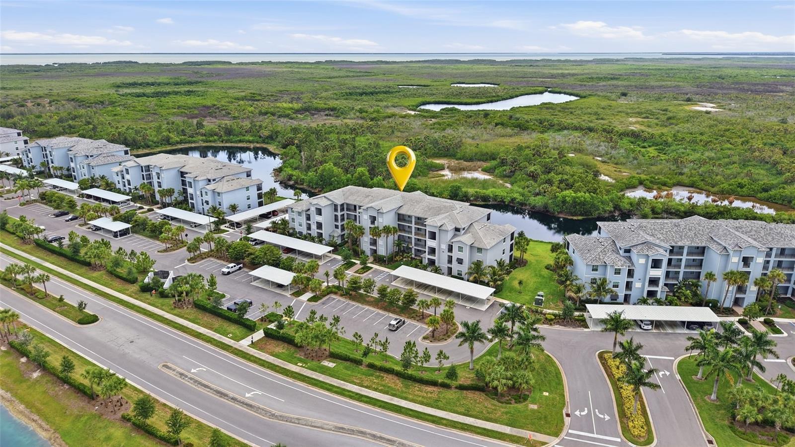 If you’ve been searching for a move-in-ready condo in a vibrant Florida golf community, one that feels like you’re on vacation every day, this is the one you’ve been waiting for. This Top 4th Floor condo enjoys beautiful views with peace and serenity creating a perfect haven to view nature and Sunsets.  It’s the perfect spot to relax with your morning coffee or unwind after a day on the course. The popular BIRKDALE model end unit welcomes you to clean lines, modern quartz counters and stainless appliances in the spacious kitchen. Ample counter space and cabinet storage elevate the spaciousness of the home. Every room features stylish décor and thoughtful touches like drapery and lighted ceiling fans. There is plenty of room for guests with the pullout sofa in the living room. You will have peace of mind with impact windows. The maintenance free condo also includes water, trash and exterior pest control. This amazing unit is offered TURNKEY for your convenience. It also INCLUDES THE HIGHLY SOUGHT AFTER GOLF MEMBERSHIP, giving you full access to the championship course including league and tournament play. Step outside and you’ll find a resort pool and 4 community pools to enjoy. The Tennis Center features Six Har Tru Tennis courts, Six Pickleball courts, Two Bocce ball courts, and a Tennis Pro is available for group and private lessons. There are several Tennis & Pickel ball leagues available to join as well as area tournaments to compete in. The Fitness Center is open 24/7 and has Nautilus workout equipment, Treadmills, Recumbent bikes, rowing machine and ellipticals plus 2 TRX workout stations and 2 Echelon Fit virtual workout mirrors. There are personal trainers and group classes available. After your workout take advantage of the relaxing saunas. The main resort pool is located near the Tiki bar. The Tiki bar is open daily and serves food and beverages, has three big screen TVs for game watching and weekly live entertainment. The Club House features Grill Room dining and meeting rooms. There is an onsite Activities Director that keeps the community entertained year-round. Whether you're lounging poolside, playing a round of golf, or taking advantage of the community's many social activities, this home delivers the ultimate maintenance-free resort lifestyle. Nestled in a charming coastal harbor town between Sarasota and Naples, you'll enjoy a laid-back atmosphere while remaining close to world-class dining, shopping, and beaches. This condo is not just move-in ready it’s ready for you to start living your best life.