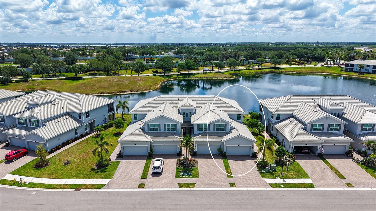 Welcome to Tidewater Preserve, a premier boating community for a Waterfront Lifestyle. The Marina has boat slips that you can rent monthly through the activity director! Attention, this 1st floor Coach home was BUILT in 2019 and is located in the New Shores part of Tidewater. This particular home looks like a model, and it has been lovingly maintained. Looks brand new! Live life in this wonderful 3-bedroom, 2-bathroom home which has lovely long water views! This home has hurricane rated windows and sliders. The new owners will enjoy the lanai screened door for convenience and also the fact that this is a pet friendly community that has its own dog park. Tidewater Preserve is a lifestyle! The unit itself has crown molding, tile on the diagonal with tile in the bedrooms, no carpet, Ring security doorbell system, cameras, flood lights, coded entry, Honeywell smart thermostat connected to Alexa. The kitchen has Quartz counter tops along with a large island also made of quartz, and newer stainless-steel appliances, walk in pantry, great breakfast bar area for additional seating, modern pendant lights, stylish backsplash, and a separate laundry room. The dining room has a lovely chandelier perfect for entertaining. Your clients will love the Open floor plan. The primary bedrooms have walk-in closets, and the ensuite has a wonderful shower, soaking tub, and dual sinks with quartz countertops. The attached 2 car garage has added storage racks added for additional space. Tidewater Preserve is conveniently located near I75, its main pool rivals top resorts with River views and an outdoor grill. The Clubhouse has a nice community kitchen, pool table, fireplace, library and hosts many events. They have 2 fitness centers, 2 satellite pools, a Marina with a 2nd Clubhouse, tennis courts, kayak and canoe launch, walking trail for scenic walks overlooking the Manatee River. Come see what all the fuss is about and leave the concrete jungles up North! Boat slips are immediately available for up to 32 feet.