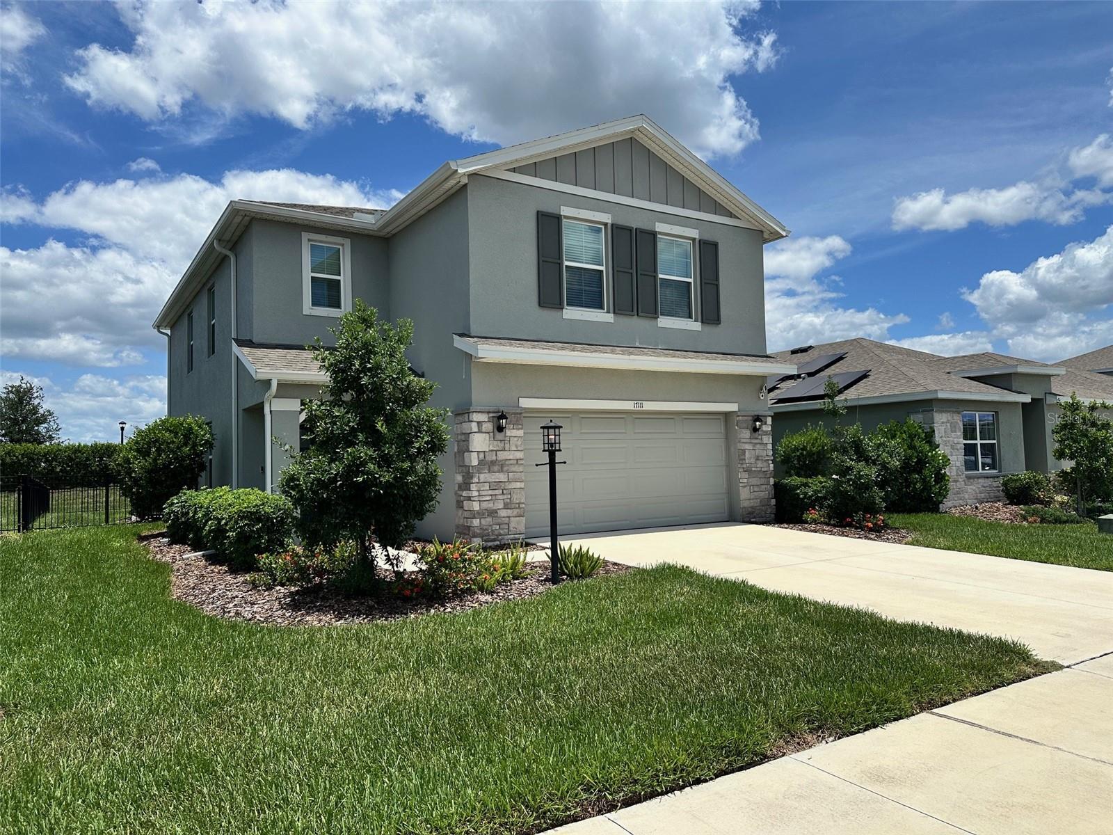 Welcome to this beautifully maintained 4-bedroom, 2.5 bath home located in the highly sought-after Star Farms community of Lakewood Ranch. Offering an open-concept floor plan with spacious living areas and modern finishes throughout, this home is designed for both everyday living and entertaining. The kitchen features stainless steel appliances, ample cabinetry, and a large island overlooking the main living area. Step outside to enjoy the expansive screened lanai complete with a custom outdoor kitchen featuring a built-in BBQ grill, refrigerator, and L-shaped counter space, creating the perfect setting for outdoor dining and gatherings. A built-in electric fireplace in family room adds warmth and ambiance to the indoor living space. The primary suite offers a spacious retreat with a walk-in closet and private bath. Residents enjoy resort-style amenities including pools, fitness center, clubhouse, sports courts, playgrounds, walking trails, Cafe, Restaurant/bar and community events. Conveniently located near top-rated schools, shopping, dining, golf, and all that Lakewood Ranch has to offer. Move-in ready and waiting for its next owner. Seller is a licensed Florida real estate sales associate.