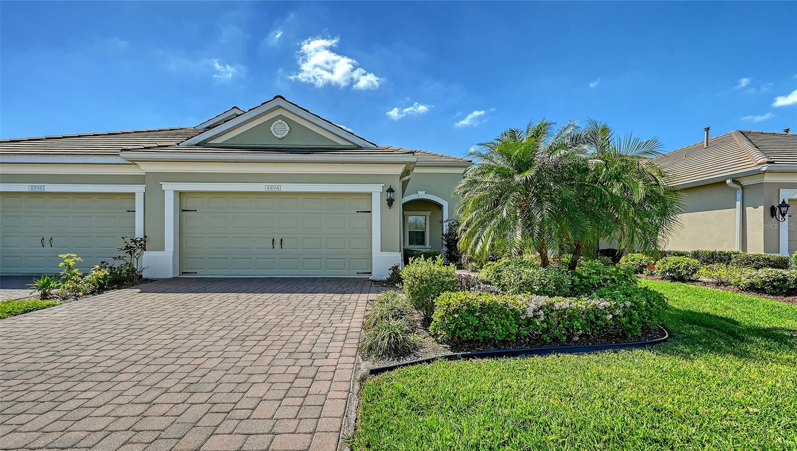 Move-in ready, turnkey furnished, 2-bedroom plus den villa with 2 car garage is located in the sought-after, maintenance-free, gated community of Fairfield. The Tidewater open concept floorplan has a dining nook, great room that boasts 9’ tray ceiling and large pocket sliding glass doors that lead to the covered lanai. The spacious kitchen\great room combo is perfect for casual dining and entertaining. Kitchen offers white cabinets, beautiful granite countertops, backsplash, stainless steel appliances, gas range, pantry closet and large center island with bar seating. The primary suite features large window offering natural light, dual closets, dual vanities, tiled walk-in shower and private toilet room. Second bedroom and bath are located away from the master offering privacy for guests. Den offers a laminated floor which provides a flex space for office, TV room, or third bedroom. The paver driveway and front patio add to the home’s curb appeal along with the tile roof. Unwind on your private, spacious lanai, perfectly designed for year-round outdoor enjoyment. Fairfield is a beautifully landscaped, pet-friendly community with low HOA fees and amenities that include a heated pool and spa, clubhouse, fitness center, and a full calendar of community activities. HOA fees cover lawn and exterior maintenance, roof replacement, insurance, and gate with no CDD fees. Conveniently located near numerous beaches including Siesta Key, UTC Mall, dining, shopping, entertainment, new aquarium, championship golf courses, the public library, pristine Gulf beaches, I-75, SRQ International Airport, and downtown Sarasota & Bradenton, and much more that the Sunshine State has to offer! This home offers the perfect blend of comfort, convenience, and Florida lifestyle.
