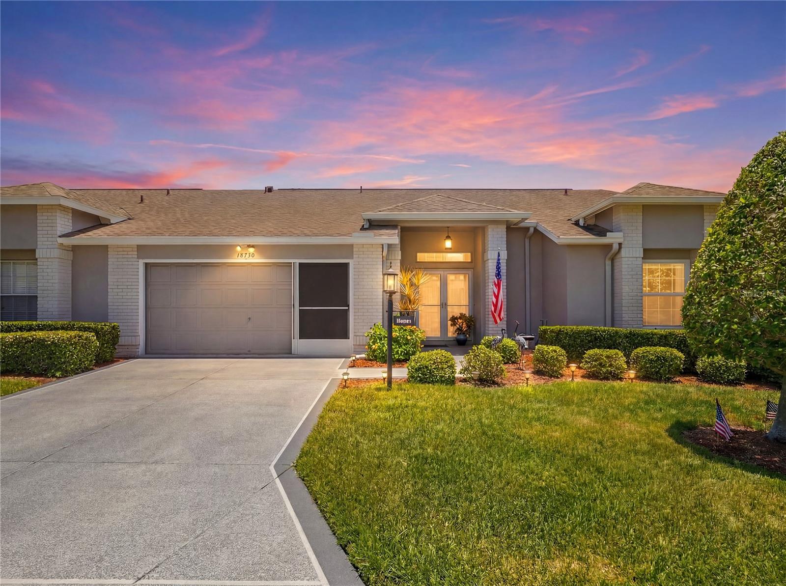 Welcome to this beautifully updated villa in the highly sought-after Heritage Pines Golf Community, a premier 55+ gated community in Hudson. This move in ready home offers 2 bedrooms, 2 bathrooms, and over 1,800 square feet of living space.

Curb appeal abounds with a professionally painted driveway and walkways leading to the double-door entry with newer storm doors featuring retractable screens. A rare secondary entrance provides direct access to the 2-car garage, complete with sliding screen doors, new screens and rollers, a new garage door motor and springs, and a 240V outlet for electric vehicle charging.

Inside, soaring cathedral ceilings and an open floor plan create a spacious atmosphere. New luxury vinyl plank flooring flows throughout the entire home, while brand-new double-pane tilt windows and all-new screens provide improved energy efficiency and comfort.

The kitchen has been tastefully updated with stainless steel appliances, soft-close hardware, new cabinet pulls, LED puck lighting, a closet pantry, breakfast bar, and separate dinette area. Updated lighting fixtures and ceiling fans have been installed throughout the home.

The spacious primary suite features dual walk-in closets and an en-suite bath with dual sinks, updated fixtures, linen closet, and walk-in shower. The guest bedroom also offers a large walk-in closet and convenient access to the guest bath. Additional features include an indoor laundry room with cabinetry, built-in desk, and included washer and dryer.

Relax on the enclosed lanai with brand-new screens, while leaf filters installed on all gutters provide additional convenience and low maintenance. Major updates include a roof (2019), HVAC system (2021), and water heater (2015). To get around the community the seller is also including a 2021 EZGO Street 4 seater golf cart equipped with 4 new tires, windshield, lights, and lithium battery.

Heritage Pines residents enjoy maintenance-free living with HOA fees covering gated security, cable, internet, lawn care, exterior painting, termite protection, and irrigation. Resort-style amenities include an 18-hole championship golf course, heated pool and spa, clubhouse with restaurant and bar, fitness center, billiards room, woodworking shop, arts and crafts studio, performance center for shows, an active social calendar, and so much more.

Schedule your private showing today and discover everything Heritage Pines has to offer.