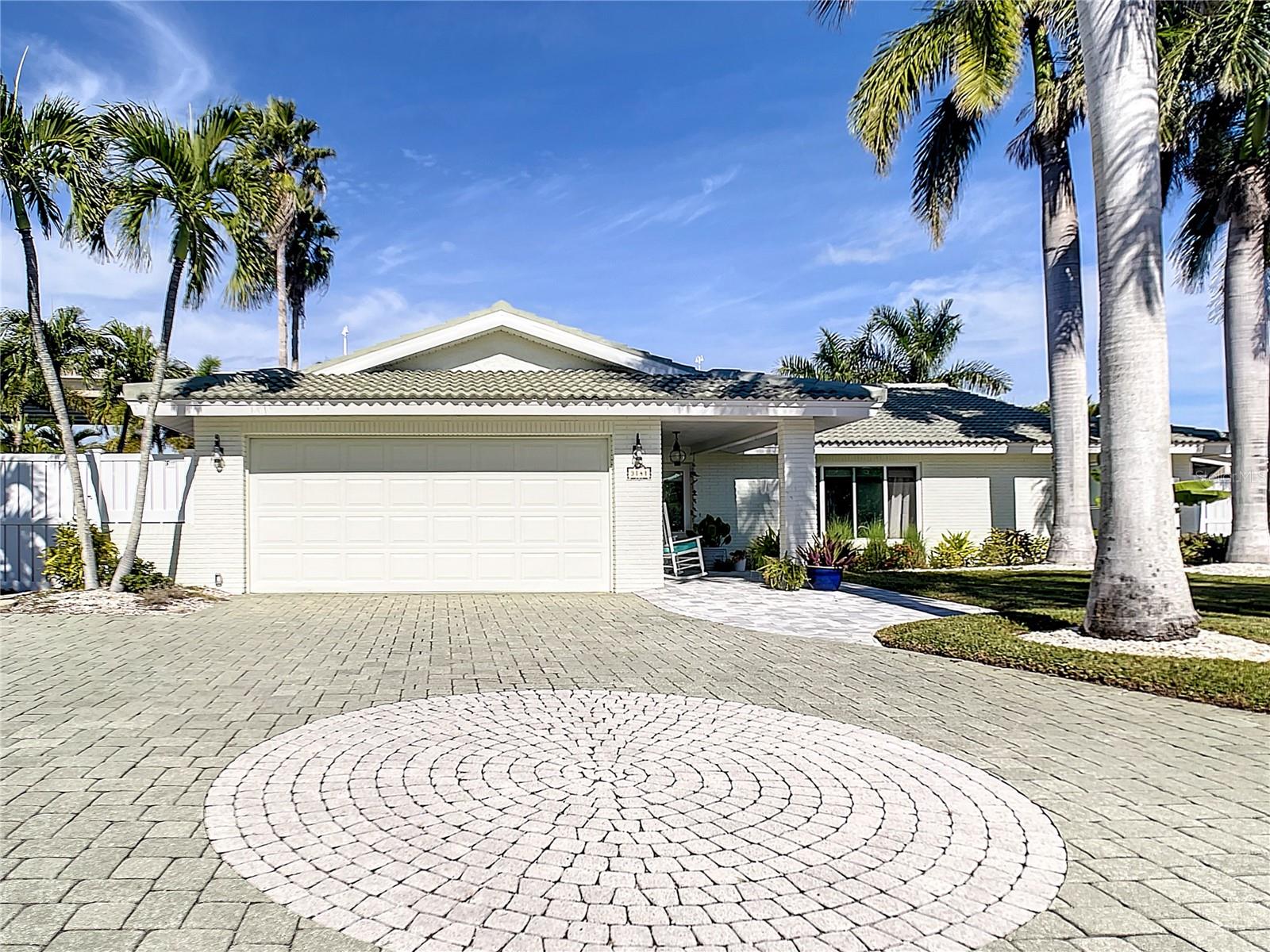 Welcome to the desirable Island of Vina Del Mar! This recently renovated 3 bedroom + 2 studies,  2 baths (see floor plan in photos), 2,200 sq. ft. coastal living home is versatile enough to accommodate the extended family members with privacy and comfort. This lot is 106 ft. of waterfront with Panoramic views all the way to Gulfport. The no wake zone, allows you to enjoy the activity of boat traffic, along with the kayaks, paddle boards and the playful dolphins. Enjoy the views while dipping in your pool. All new hurricane impact windows, continuous luxury vinyl flooring throughout. Interior laundry, beautiful KraftMaid cabinetry with quartz countertops, induction cooktop and impressive newer seawall. Expansive views of Boca Ciega Bay while creating that special meal, dining, relaxing or just waking up. South of the Don Cesar is a very special paradise to walk, bike, drive your golf cart to the beach, restaurants and our special local shops. Book your appointment. Don’t miss your chance to live on The Island of Vina Del Mar.