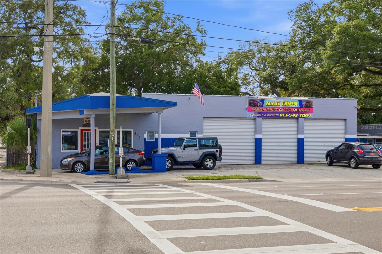 A rare opportunity to own one of Seminole Heights' most recognizable commercial corners. Positioned in the center of one of Tampa's fastest growing neighborhoods, this high visibility property sees thousands of vehicles pass by every day and is surrounded by thriving restaurants, craft breweries, boutique retail, and newly developed residential communities.
Currently operating as a successful auto repair shop, auto sales business, and body shop, this Seminole Heights CI zoned property is ready for its next chapter. Whether you're looking to expand your existing business, launch a new venture, or capitalize on the area's incredible redevelopment momentum, this property offers the flexibility and location to make it happen.
The property features two well equipped buildings designed for efficiency and versatility. The front building includes two fully operational automotive lifts plus an apartment, creating the opportunity for additional rental income, office space, or owner occupancy. The rear building offers six service bays and dedicated office space, providing ample room for automotive operations or a variety of commercial uses.
Additional highlights include EPA certification, compliance with City of Tampa regulations, a secure privacy fence, and the convenience of a working alley behind the property.
Location is everything, and this one delivers. Just minutes from Downtown Tampa, Armature Works, Tampa International Airport, professional sports venues, major highways, world class beaches, and some of the city's most popular entertainment destinations, this property is perfectly positioned in the path of continued growth.
Commercial opportunities like this are becoming increasingly difficult to find in Seminole Heights. Move your business in immediately, generate income from day one, or secure a premier corner for future development. With unmatched visibility, flexible zoning, and endless potential, this is more than a property. It's an investment in one of Tampa's most exciting and rapidly evolving neighborhoods.