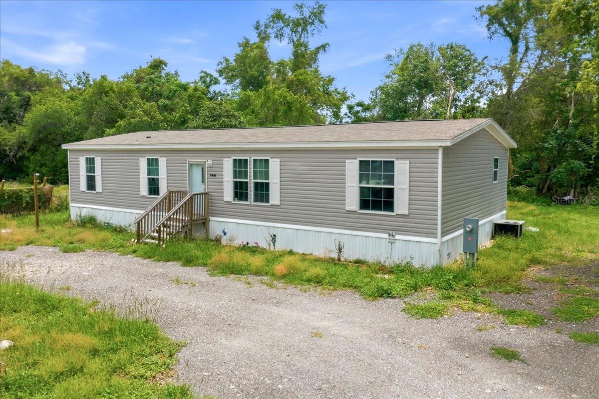 Your search for the perfect place to call home ends here! This beautiful 4 bedroom, 2 bath home offers 1,568 square feet of comfortable living space on 0.25 acres. Built in 2023, this move in ready home combines modern style with everyday convenience, featuring durable linoleum flooring throughout and a spacious open concept floor plan perfect for both relaxing and entertaining. The kitchen features a large cooking island, stainless steel appliances, and plenty of room for everyone to gather while cooking. The spacious primary suite offers a walk in closet and a private en suite bathroom for your own relaxing retreat. While the split bedroom floor plan provides privacy, with the 3 guest bedrooms on the opposite side of the home along with a second full bathroom. Step outside and enjoy the Florida lifestyle from your spacious backyard with plenty of room to add a pool, garden, or play area. The yard is fenced on 3 sides and backs up to acreage for added privacy, plus there is plenty of room for your toys.Conveniently located near shopping, dining, entertainment, outdoor adventures, and beaches, plus less than a mile from the Suncoast Parkway for easy access to the Tampa Bay and Orlando areas. Schedule your private showing today!