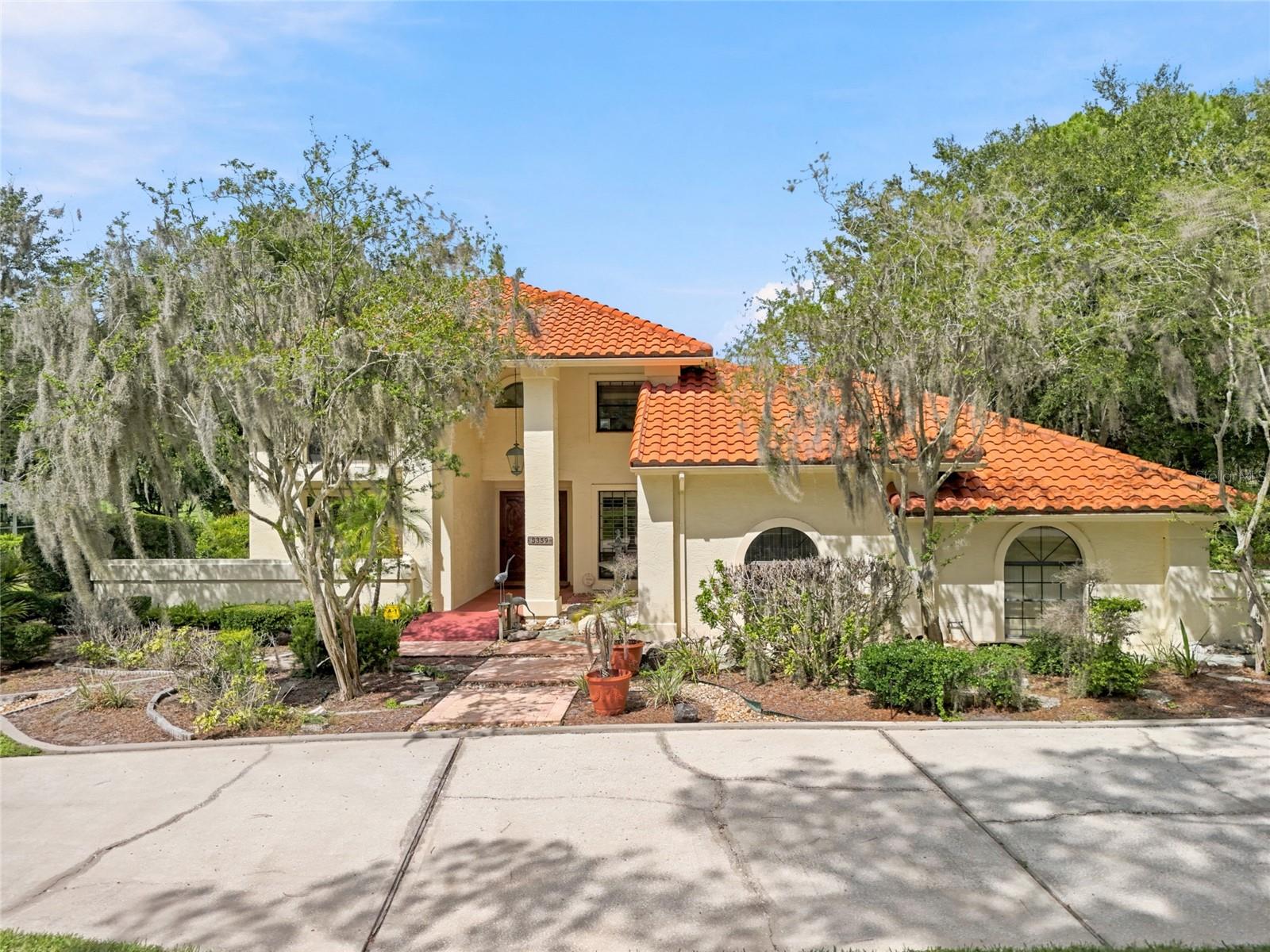 Renovated property looking to impress a buyer searching for a spectacular golf course view and a home that meets all your hearts desires. Not every home can do this for every buyer. But this view and this pool does it for the discriminating buyer. It has 4 bedrooms with 4 bathrooms, new wood floors installed downstairs, a lanai to enjoy the view while entertaining, and a study/den to work when you just have to. A kitchen when it's time to cook for the family and guests that you'll love to entertain for on those weekends, and a family room with those 10-foot-high bookcases you have always wanted, now you finally have a place for all your books.  The fireplace gives you the ambiance you always have enjoyed even if you have the lower the A/C to enjoy it on those special occasions. Truly the home you have dreamed about waiting to come on the market, and here it is. The swimming pool and spa was recently renovated, the wood floors installed in 2025, A/C units installed in 2019, water softener and water heater in 2022, tile roof in 2008.  The foyer highlights a solid oak staircase where if you choose to install a tube elevator it is always possible to add to this home.  Saddlebrook has restaurants to enjoy without joining the amenities, and outside of Saddlebrook there are many places to go shopping either by golf cart or car. There are restaurants, nail shops, Wiregrass mall, The Grove Theaters, hospitals, urgent care, dog groomers, etc.  Call to view before this is gone.