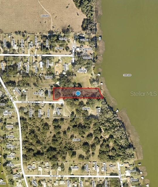 1.74 Acres on Picciola Island! Harris Chain of Lakes with approx 130 feet of waterfrontage on Lake Griffin. Off a cul-de-sac on a dead end street. Peaceful lakeside community that is popular for outdoor activities like boating and fishing.