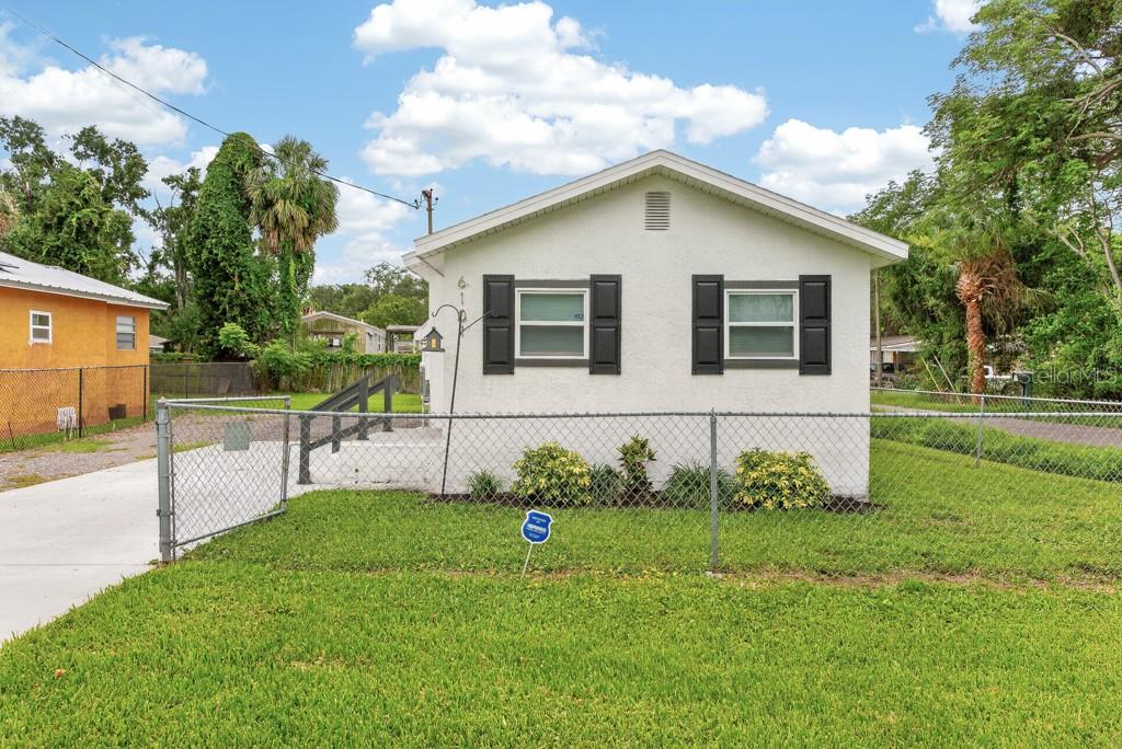 Welcome home to this beautifully remodeled 2-bedroom, 1-bath residence offering comfort, style, and peace of mind in a highly convenient location. With 824 square feet of thoughtfully updated living space, this move-in-ready home has been extensively renovated from top to bottom, making it an excellent opportunity for first-time buyers, downsizers, or investors alike. Step inside to discover updated wood-look flooring throughout, modern ceiling fans, fresh interior and exterior paint, and a bright, welcoming atmosphere. The fully renovated kitchen features custom cabinetry, a stylish backsplash, and a complete suite of stainless-steel appliances, blending functionality with contemporary design. The beautifully remodeled bathroom showcases updated finishes, while all interior and exterior doors have been replaced to enhance both appearance and efficiency. Hurricane-resistant dual-pane windows provide added security, energy efficiency, and year-round comfort. Major system upgrades offer exceptional value and peace of mind, including a newer A/C system, updated roofing, and numerous improvements throughout the home. Enjoy relaxing mornings or entertaining guests on the newly renovated screened-in back porch overlooking the fully fenced backyard—perfect for pets, gardening, or outdoor gatherings. Best of all, there are NO HOA fees and NO CDD fees, giving you greater flexibility and affordability. Conveniently located near shopping, dining, schools, and everyday amenities, with quick access to I-75, US-301, and US-41, this home is ideally situated for commuters and anyone seeking easy access to the surrounding area. Modern updates, low-maintenance living, and an unbeatable location—this charming home is ready for its next owner to move in and enjoy. ***FREE 1/0 Rate Buydown when using the seller's preferred lender!***