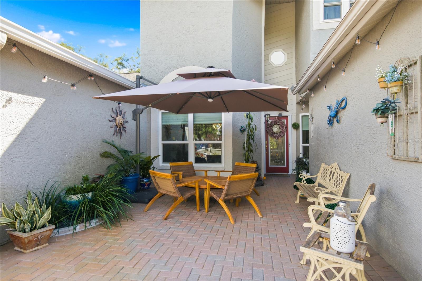 Welcome to 302 Buckingham Place, a beautifully maintained 3-bedroom, 2.5-bath Townhome nestled in the highly desirable Steeplechase community of Palm Harbor. Offering 1,848 square feet of thoughtfully designed living space, this two-story home features soaring cathedral ceilings, an open-concept layout, and a spacious first-floor Primary Suite for added comfort and convenience. The heart of the home is the beautifully Remodeled Kitchen, thoughtfully redesigned to include updated appliances, two oversized pantries with elegant frosted glass doors, Quartz countertops, custom cabinetry, and a stunning Live-edge wood peninsula with seating area to create a warm, inviting space that's perfect for both everyday living and entertaining. The Laundry area was moved inside with the redesigned space.
The bright, inviting interior showcases numerous updates including custom window treatments throughout and a stylish electric fireplace that adds warmth and ambiance to the living area. Upstairs, you'll find two generously sized bedrooms and an oversized loft, offering flexible space for a home office, media room, or guest retreat. Both the two full Bathrooms and the half bath have been remodeled and the results are stunning! The main floor En suite bathroom has a large step in shower and beautiful custom hardware. The home also has updated flooring, a tankless hot water heater, new roof in 2023 and hurricane-impact windows. Step outside to the large covered lanai overlooking a spacious private backyard, providing the perfect setting for morning coffee, outdoor dining, or relaxing year-round. The Sellers have enjoyed seeing deer and other wildlife on many occasions. The Lanai was also rescreened with mesh screen to maximize year round use. There is an additional paver patio out back that maximizes your enjoyment of the outdoors! The front entry porch is spacious and also features pavers and lots of room to personalize your space with outdoor accent pieces. The driveway has also been upgraded with pavers. Residents enjoy low-maintenance living with community amenities including a pool, tennis courts, cable and internet. Ideally located just minutes from Gulf beaches, shopping, dining, parks, and top-rated schools, this exceptional home offers the perfect blend of modern updates, timeless style, and carefree Florida living.