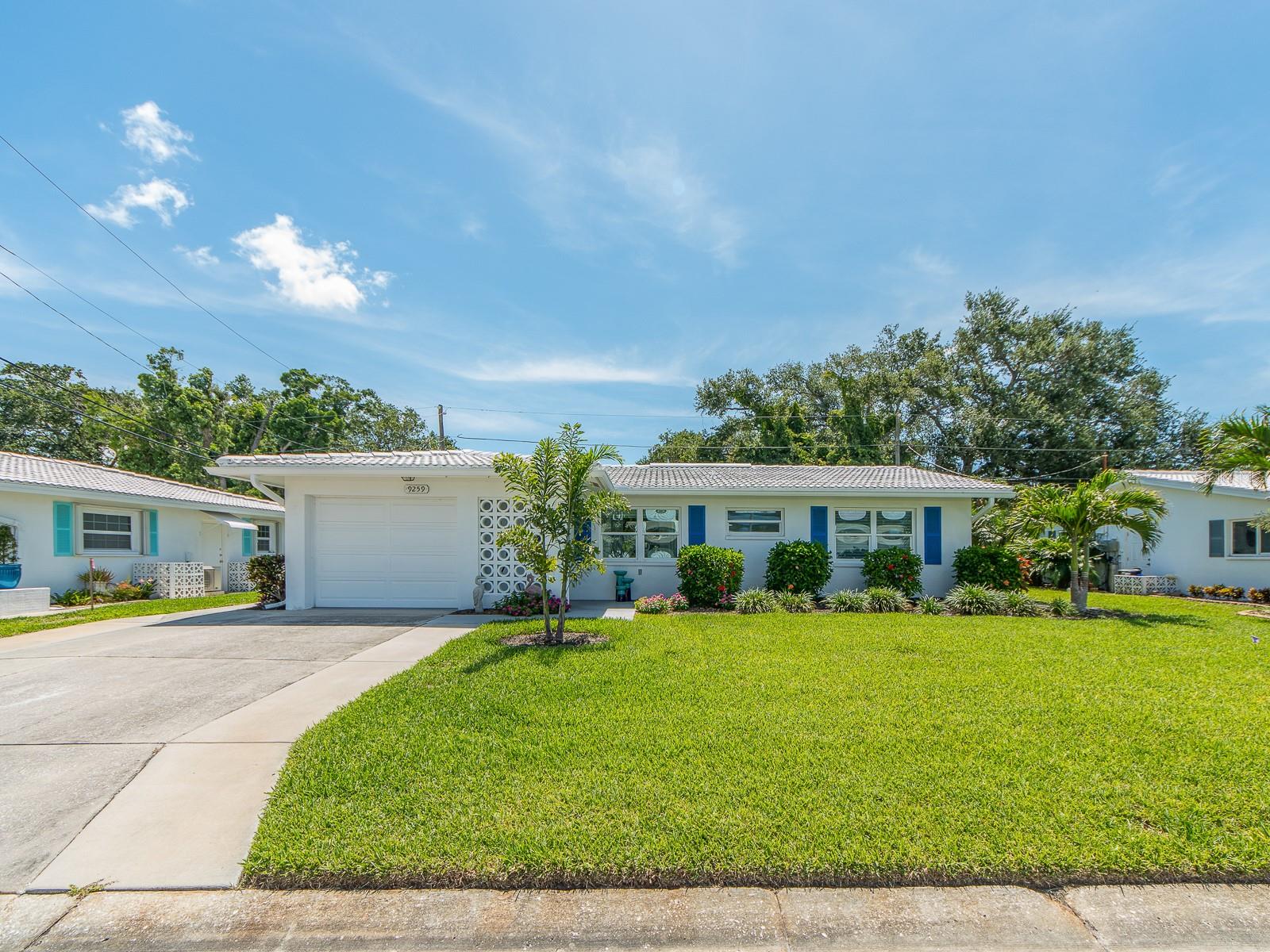 Excited about making a move? Don’t miss seeing this quintessential Florida home! The yard is manicured with palm trees and mature landscaping. It’s on the Baypointe Conservation Area with two miles of recreational trails. The home beckons you into an open floor plan with sunlight streaming through Impact windows and into a large living room. The beautiful, neutral tile floors flow throughout the house. Do you love to cook? This kitchen is a dream for entertaining. Granite countertops and beautiful cabinets to store all the equipment you just can’t do without. The Florida room overlooks the greenspace, which is the Baypointe Conservation area. Sit out on the enlarged patio and enjoy flora and fauna. We have egrets, heron, hawks and owls. Too cold to be outside?  Enjoy the spacious sunroom. This screened-in room has sliding windows to close it off from rain and chilly weather. It’s easily heated or cooled with a mini-split or a plug-in air conditioner. This home has a whole-house surge protector, outside spotlight, widened driveway, impact doors in garage and sunroom, newer dishwasher and has been painted throughout. The flat roof was done in 2013, air conditioner 2023 and impact windows 2001. The HOA monthly fee is $251.20. It covers water, sewer, trash, grass cut, home painted every 8-9 years, and roof pressure washed every 8-9 years. The clubhouse has a full calendar of events and a heated pool. Tamarac is five minutes from the beautiful beaches of the Gulf of America. It’s also close to shopping at Seminole City Center, and a wide range of wonderful restaurants up and down the beaches. A list of improvements is attached to the listing.