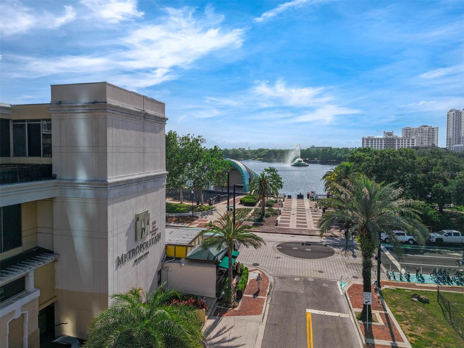 Virtually Staged. Rarely available corner-unit residence in the heart of Downtown Orlando, offering an unmatched urban lifestyle just steps from Lake Eola, world-class dining, entertainment, nightlife, sporting events, and everything the city center has to offer. Enjoy breathtaking views of Lake Eola, the iconic bandshell, and the resort-style pool below from your oversized private balcony—the perfect place to entertain guests or relax above it all.

Inside, the open-concept floor plan with floor-to-ceiling windows that frame the picturesque surroundings. The spacious primary suite features a private ensuite bath, while the second bedroom offers flexibility for guests, a home office, or additional living space. The updated kitchen combines style and functionality with stainless steel appliances, ample storage, and a dedicated laundry area.

Major recent updates include two new A/C air handlers (2026), a new oven and garbage disposal (2026), refrigerator and microwave (2023), and washer and dryer (2024)—providing added value and peace of mind for the next owner.

Convenience is elevated with a private garage elevator that delivers you directly to your front door—eliminating long hallways and lobby waits. The unit also includes two deeded side-by-side parking spaces, a rare and highly desirable feature in Downtown Orlando.

Adding to the home's appeal is a rare oversized interior storage unit—perfect for bicycles, fitness equipment, and all the essentials for enjoying Lake Eola and Downtown Orlando's active, walkable lifestyle. Amenities like this are seldom available within the community and highly valued by urban homeowners.

Combining spectacular views, exceptional convenience, extensive recent updates, and an unbeatable location in the center of it all, this residence presents a rare opportunity to experience the very best of Downtown Orlando living.