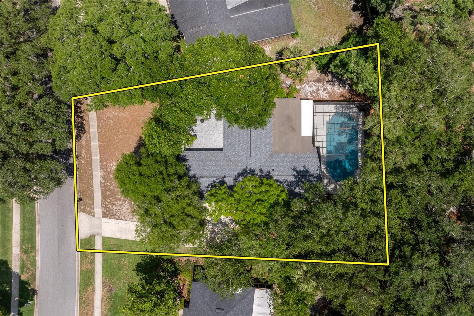Situated on a spacious 0.38-acre lot in the highly sought-after Tuscawilla community of Winter Springs, this beautifully updated pool home combines thoughtful upgrades, flexible living space, and inviting outdoor areas with the added benefit of NO HOA. Inside, the remodeled kitchen opens to the main living spaces and showcases updated cabinetry, stone countertops, tile backsplash, stainless steel appliances, recessed lighting, and a custom range hood. A newly added pantry and bar area complement the open kitchen design. The split-bedroom layout offers added privacy, with the primary suite tucked away on one side of the home and the secondary bedrooms positioned on the opposite side. The primary suite also features a walk-in closet and versatile bonus space ideal for a home office, nursery, gym, or sitting area. Multiple living and flex spaces provide endless options for entertaining, working from home, or creating additional lounge and dining areas. Major updates include new Luxury Vinyl Plank flooring throughout, fresh interior and exterior paint, upgraded bathrooms, full home replumb and complete rewire (2026), new roof (2024), HVAC (2019), and water heater (2018). Step outside to enjoy an oversized resurfaced and retiled screened pool, expansive lanai and deck space, fully fenced backyard, and a newly paved private front courtyard designed for relaxing and gathering outdoors. Located near Tuscawilla Country Club, Central Winds Park, shopping, dining, Publix, Winter Springs High School, and SR-417, this home offers the perfect balance of privacy, convenience, and the established charm Tuscawilla is known for.