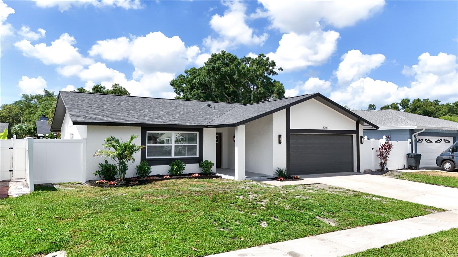 Natural light, soaring vaulted ceilings and an open-concept design create the perfect setting for comfortable Florida living in this beautifully maintained 3-bedroom, 2-bath, 2-car garage home, ideally located in a non-flood zone. The spacious living room flows seamlessly into the impressive kitchen, featuring stainless steel appliances, recessed lighting, custom cabinetry, quartz countertops, a stylish backsplash, a farmhouse sink and an oversized island perfect for gathering with family and friends. A custom bar area with additional cabinetry and a wine fridge provides the ideal space for entertaining between the kitchen and living room. The generous primary suite offers a walk-in closet and a private en-suite bath with a walk-in shower. Step outside to your own backyard retreat with a screen-enclosed in-ground pool and fully fenced yard, offering plenty of space to relax, entertain, or enjoy the Florida sunshine. Conveniently located near the scenic trails of Walsingham Park, the shops and restaurants of Seminole City Center, beautiful Indian Rocks Beach and Madeira Beach, as well as abundant shopping, dining, and entertainment, this home offers the best of the Florida lifestyle. Don't miss your opportunity to make this exceptional property your own, schedule your private showing today!