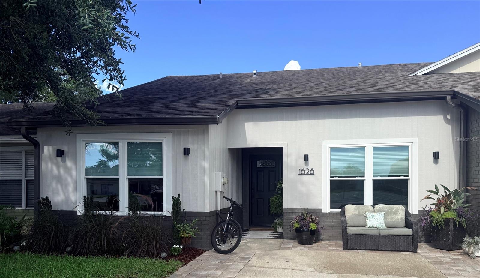 A beautifully upgraded three-bedroom, two-bath villa offering refined finishes, modern systems, and effortless luxury living in one of Tavares’ most convenient and desirable locations. Every major improvement has already been completed, giving buyers a true turnkey experience.

This impeccably maintained home features all-new windows, a 2017 roof, seamless gutters, and wood plank ceramic tile flooring throughout, creating a polished, low-maintenance interior with timeless appeal. The living room’s fireplace adds warmth and sophistication, anchoring the open layout with a welcoming focal point.

The upgraded kitchen includes an induction oven, refrigerator and dishwasher (approx. 2 years old), and a washer/dryer set less than 2 months old. A tankless water heater provides endless efficiency, while both bathrooms have been thoughtfully modernized with quality finishes. The home also offers exceptional storage, a rare luxury in villa living.

Step outside to your private paver patio, perfect for morning coffee, quiet evenings, or entertaining in a serene outdoor setting.

Residents enjoy a low-HOA lifestyle with access to a community pool and tennis courts, adding to the resort-style feel of the neighborhood.

Located just minutes from the Tavares YMCA, downtown Tavares, AdventHealth Waterman, shopping, dining, and waterfront entertainment, this villa blends luxury, convenience, and peace of mind in one beautifully upgraded package.

A standout opportunity for buyers seeking a upscale, fully updated villa in a prime Tavares location.