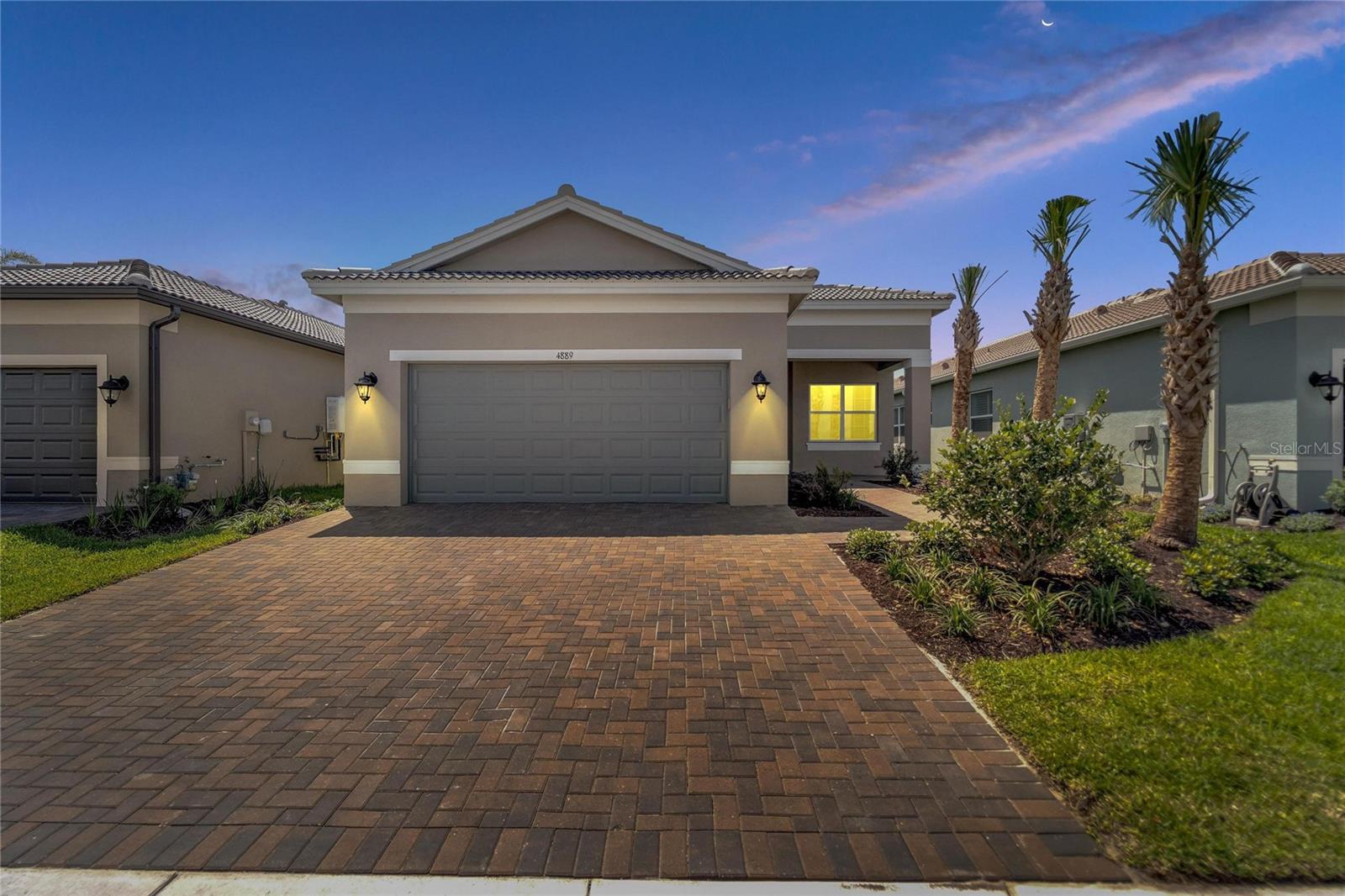 Your Florida home awaits! Amazing opportunity!  BRAND NEW Home for YOU!  Be the first to live in this stunning home in DEL SOL! Come see why everyone is moving to this luxury 55+ community. Great layout with three bedrooms, 2 baths, ALL tile floors, upgraded kitchen and bright and open living areas.  Conservation LOT with lovely waterview - Enjoy this outdoor space with an extended screened lanai and a pavered patio. You will feel the openness when you walk in. Bright and Open Great Room with a slider leading to the lanai offers lots of natural light. The Chef of the house will love the upgraded Kitchen with gas stove, two toned cabinet colors, lots of storage space, stainless steel appliances, walk-in pantry, space for bar stool seating and a sunny dinning nook overlooking the water view in the back.  Three way split in with the bedrooms makes for easy living.  Bedroom 3 has double doors and could be a great spot for your home office. Spacious Master Suite with large bedroom, two closets, two sinks, plenty of counter space to get ready in the mornings and a nice shower.  All of this in the popular Valencia De Sol community.  Gated and premier 55+ living.  State of the art amenities and events to keep your calendar full! 
Dazzling 25,000 square foot Clubhouse with a resort-style pool, on-site café with indoor and outdoor seating, grand social hall, variety of racquet sports courts, dog park and more, Valencia del Sol has it all. There’s no better place to live the ultimate 55+ Florida lifestyle.  Location is between Tampa and Sarasota for you to enjoy the perks of both cities and events.  Plus the famous sunny beaches of Florida.  Come see this house today and be the FIRST to make it a home!
