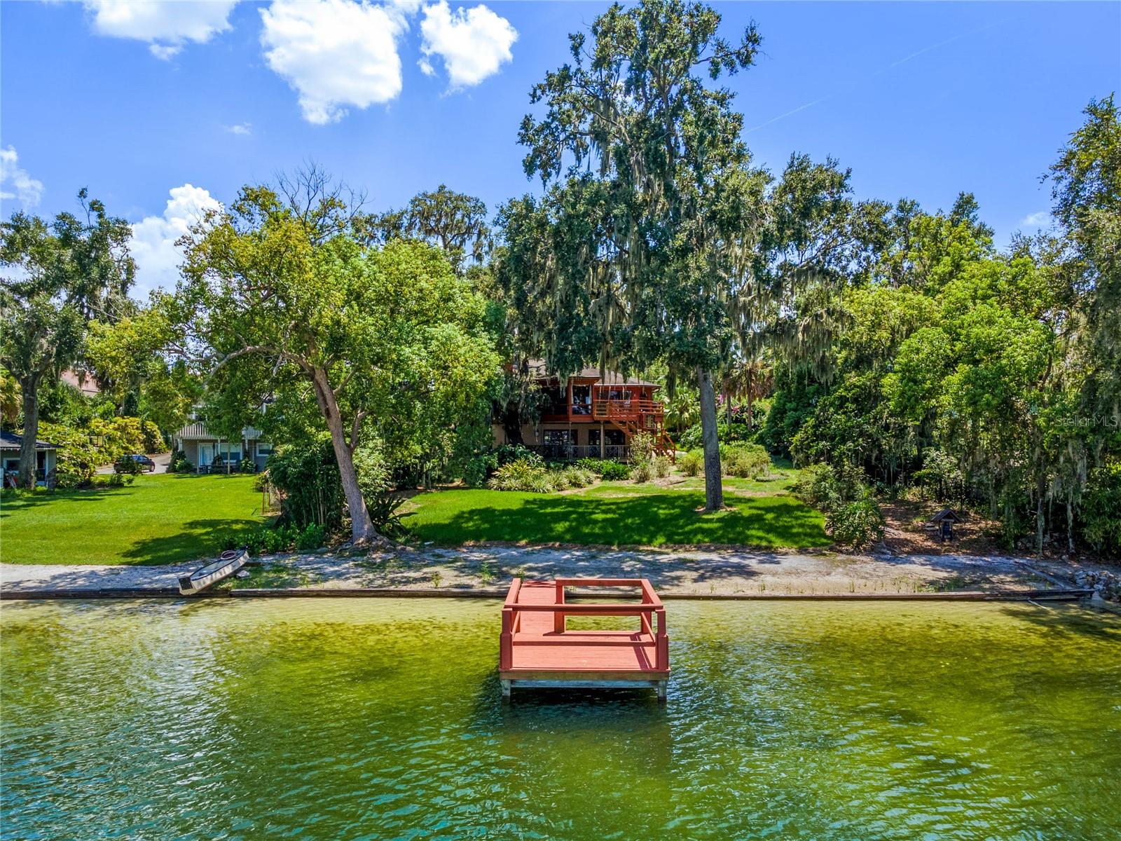 BUYERS FINANCING FELL THROUGH! BACK ON THE MARKET! Prepare to be dazzled by Lake Jennie Jewel nestled on a picturesque tree-lined street on sought-after Gatlin Avenue. You will immediately feel a sense of old Florida in this enchanting home while still be around the corner from modern amenities such as restaurants, retail stores and hiking trails. This two-bedroom, two-bath home plus office boasts 100 feet of stunning lake frontage. Watch Florida’s breathtaking sunsets from your private dock. Lake Jennie Jewel is a spring-fed, skiable 70-acre lake with private boat ramp. The treasure of this home is the panoramic lake views from the primary bedroom, family room and decks. Proximity to downtown Orlando, Disney, downtown business community and central Florida’s top destinations. Zoned for Pershing School and Boone High School. This home is a diamond in the rough, don’t miss out! Call to schedule your private showing today.