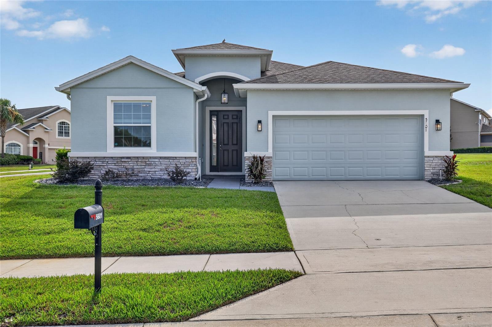 Welcome home to this beautifully maintained 4-bedroom, 2.5-bath home located on a spacious corner lot in a gated pool community. Built in 2018, this split-plan home offers 2,053 square feet of thoughtfully designed living space with tile and laminate flooring, an open floor plan, and no carpet throughout.  Step inside to a spacious foyer that opens into the heart of the home, where entertaining comes naturally. The kitchen features granite countertops, a breakfast bar with pendant lighting, and plenty of cabinet and counter space. The kitchen overlooks the expansive living area and dedicated dining space. Triple sliding glass doors fill the home with natural light and create a seamless connection to the covered backyard patio. The primary suite is spacious and inviting with a tray ceiling and two walk-in closets. The ensuite bathroom offers a raised dual-sink vanity, a beautifully updated glass step-in shower, and a garden tub.  The split floor plan places 2 of the guest bedrooms on the opposite side of the home for added privacy, each with spacious closets. The fourth bedroom is currently being used as a home office and features built-in cabinets and a desk, making it the perfect flex space for working from home, a playroom, or an additional bedroom. 
Additional features include an indoor laundry room, irrigation system, a two-car garage, a community pool, and an ideal location zoned for the brand-new Winding Oaks Elementary School.  This well-maintained home is conveniently located just minutes from grocery stores, shopping, restaurants, medical facilities, and just 1 mile from the VA clinic. Move right in and start enjoying the space, convenience, and lifestyle this home has to offer. 
Measurements are estimates, buyer to verify. The property information provided is deemed to be true and correct, however, Keller Williams Realty Inc., nor its agents, guarantee the accuracy of the information.