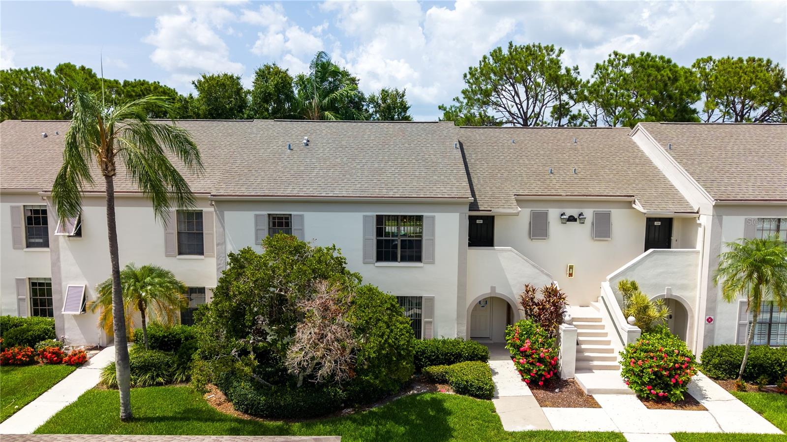 Welcome to 2497 Heron Terrace #203, an updated 2-bedroom, 2-bathroom second-floor condo in Bordeaux Village, located in the highly desirable Feather Sound community. This is the type of property buyers wait for — updated, spacious, easy to maintain, and positioned in one of the most convenient locations in Pinellas County. The layout is practical and comfortable, with large bedrooms, an open living and dining area, and a spacious updated kitchen. Just inside the front door, a dedicated mudroom and shoe closet area adds the kind of everyday storage most condos simply do not offer. The washer and dryer are included, making the home truly move-in ready. The primary suite stands out with a large walk-in closet and a renovated bathroom featuring both a tub/shower combination and a separate walk-in shower. With three total showers in the home, the layout offers unusual flexibility for guests, seasonal visitors, or everyday living. The screened patio provides a private place to enjoy morning coffee, fresh air, or a quiet evening at home. Assigned covered parking is located very close to the front door, and additional storage adds even more convenience. Newer roofs across the community provide another major advantage for buyers looking for long-term value. The monthly fee includes exterior maintenance, grounds maintenance, sewer, trash, water, cable, internet, pest control, and more, creating a true lock-and-leave lifestyle. The location is difficult to beat. Feather Sound puts you approximately 15 minutes from Tampa, downtown St. Petersburg, and downtown Clearwater, with quick access to shopping, dining, golf, major roadways, both area airports, and the Gulf beaches. Whether used as a full-time residence, seasonal home, or low-maintenance Florida retreat, this one deserves a serious look before someone else gets there first.