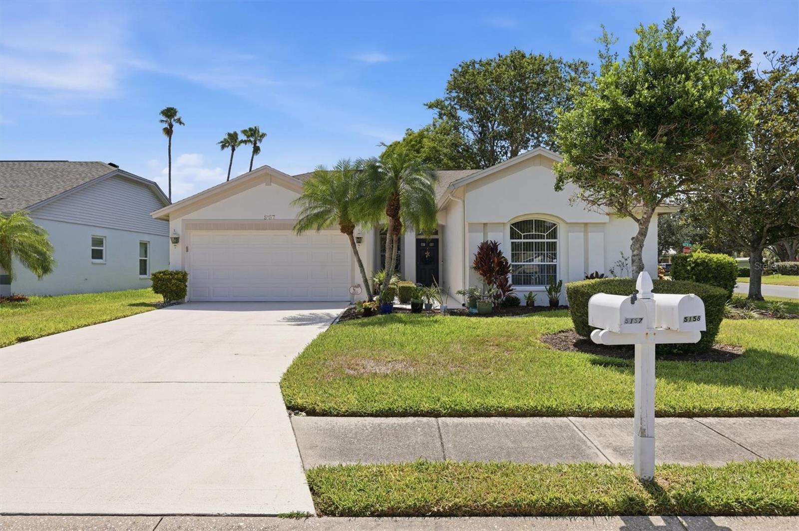 Virtually Staged. Offered for the first time in 33 years by its original owner, this well-maintained 4BR/2BA home with a 2-car garage is situated on an oversized corner lot in a highly desirable, established neighborhood known for its many long-time residents. Lovingly cared for over the years, the home is move-in ready while offering the perfect opportunity for a new owner to add personal touches and updates to suit their style. The thoughtfully designed split-bedroom floor plan features vaulted ceilings, spacious living, dining, and family rooms that flow seamlessly together, with the kitchen serving as the heart of the home. Sliding glass doors open to a screened lanai, creating the perfect space for indoor-outdoor living. Recent updates include a brand-new HVAC system. Located in Flood Zone X, no flood insurance is required, and the home has never flooded. Conveniently located near IMG Academy and Detwiler's Market, with Gulf beaches, dining, shopping and entertainment just a short drive away.
