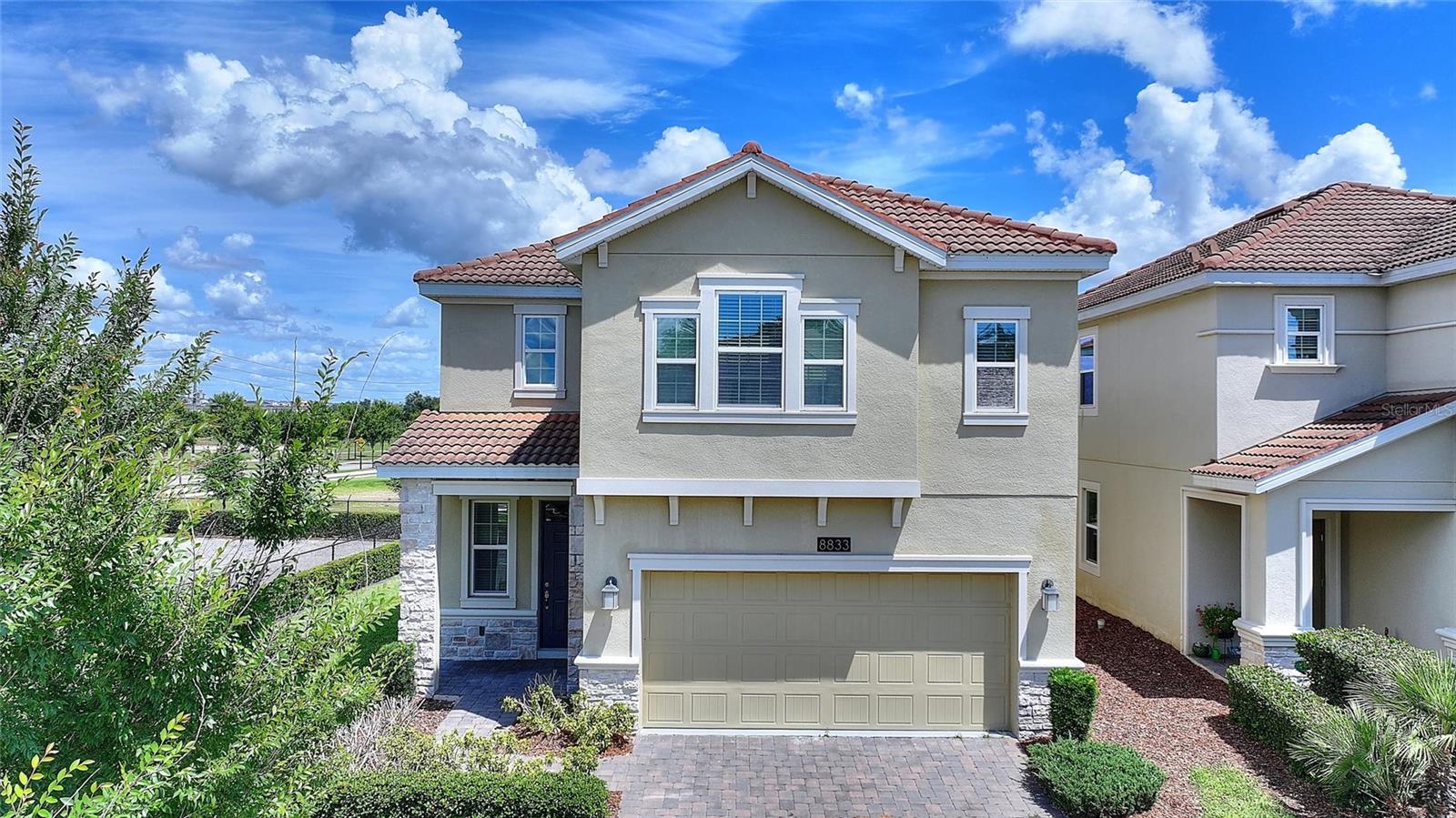 LIVE LIKE A CHAMPION! FULL GOLF MEMBERSHIP INCLUDED IN HOA!

Perfectly positioned just steps from the residents-only North Pool and neighborhood park, this immaculate 4-bedroom, 2.5-bathroom home in the highly sought-after ChampionsGate Country Club offers over 2,300 square feet of thoughtfully designed living space. Originally built as the builder's model home, this residence showcases premium upgrades and designer finishes throughout, setting it apart from the competition. From the moment you enter, you'll appreciate the attention to detail, upgraded features, and quality craftsmanship found in every room.

Enjoy beautiful golf course views from the north-facing lanai, providing the perfect setting for morning coffee, evening relaxation, or entertaining family and friends.

Inside, you'll find a gourmet kitchen featuring stainless steel appliances, quartz countertops, 42" upper cabinets, and a spacious center island that serves as the heart of the home. The luxurious primary suite offers a large walk-in closet, dual vanities, a soaking tub, and a tiled walk-in shower. Additional living spaces are thoughtfully designed to provide comfort, functionality, and room to grow.

ChampionsGate Country Club residents enjoy an unmatched resort lifestyle. The HOA includes a full golf and tennis membership, allowing two adults and children up to age 22 to enjoy the championship golf course, practice facilities, tennis courts, and more. Residents also enjoy access to the Oasis Club, featuring a restaurant, tiki bar, lazy river, fitness center, movie theater, game room, cabanas, and resort-style pools. The exclusive residents-only Plaza offers an additional restaurant, bar, fitness center, game room, and pool, while the Retreat Club features a water park and outdoor bar & grill.

The HOA also includes gated security, complete lawn care, cable, internet, phone, trash service, and security monitoring, delivering a truly maintenance-free lifestyle.

Ideally located just minutes from world-class golf, shopping, dining, major highways, and Central Florida's famous attractions, this exceptional home offers the perfect combination of luxury, convenience, and resort-style living.