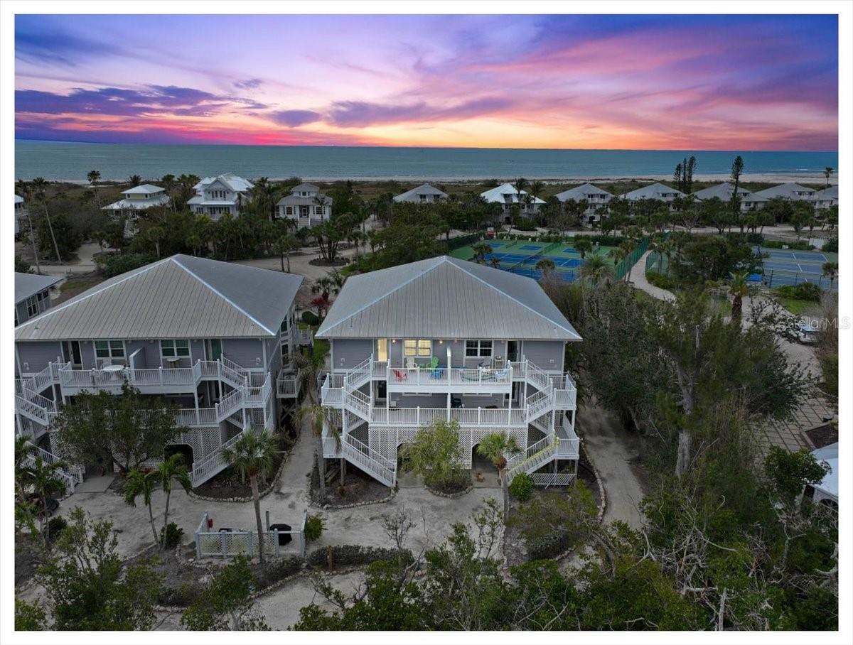 Turnkey Furnished Condo in Palm Island Resort – Coastal Serenity Awaits!

Move right into this beautiful condo in the stunning Palm Island Resort. Featuring an open kitchen with elevated ceilings, Corian countertops,  and additional bar cabinetry, this home seamlessly blends elegance with functionality. 
Enjoy private beach access just a short walk away, leading to the breathtaking Gulf of Mexico. The clubhouse, gym, heated swimming pool, spa, and tennis/pickleball courts are all within easy walking distance, ensuring effortless resort living.

Take in stunning screened-in views from the rear balcony, while the front balcony overlooks Rum Bay and the Intracoastal Waterway. Relax on your porch as you watch manatees, dolphins, and an active Osprey nest in their natural habitat.

This rare condo includes a garage—a coveted feature—(with the ability for housing a golf cart, paddleboards, and all your beach gear), providing unmatched convenience. Community boat docks are located just behind the condos on Rum Bay, perfect for boating enthusiasts.

Resort amenities include private beach access, boat docks, a heated pool/spa, tennis courts, a fitness center, a clubhouse, playgrounds, a restaurant & bar, and 24-hour security. Additional services like bell service, mail delivery, and rentals for golf carts, bicycles, and water sports ensure a seamless island lifestyle.

Escape the ordinary and embrace the ultimate in coastal living—where the beach meets the bay, and tranquility meets luxury.