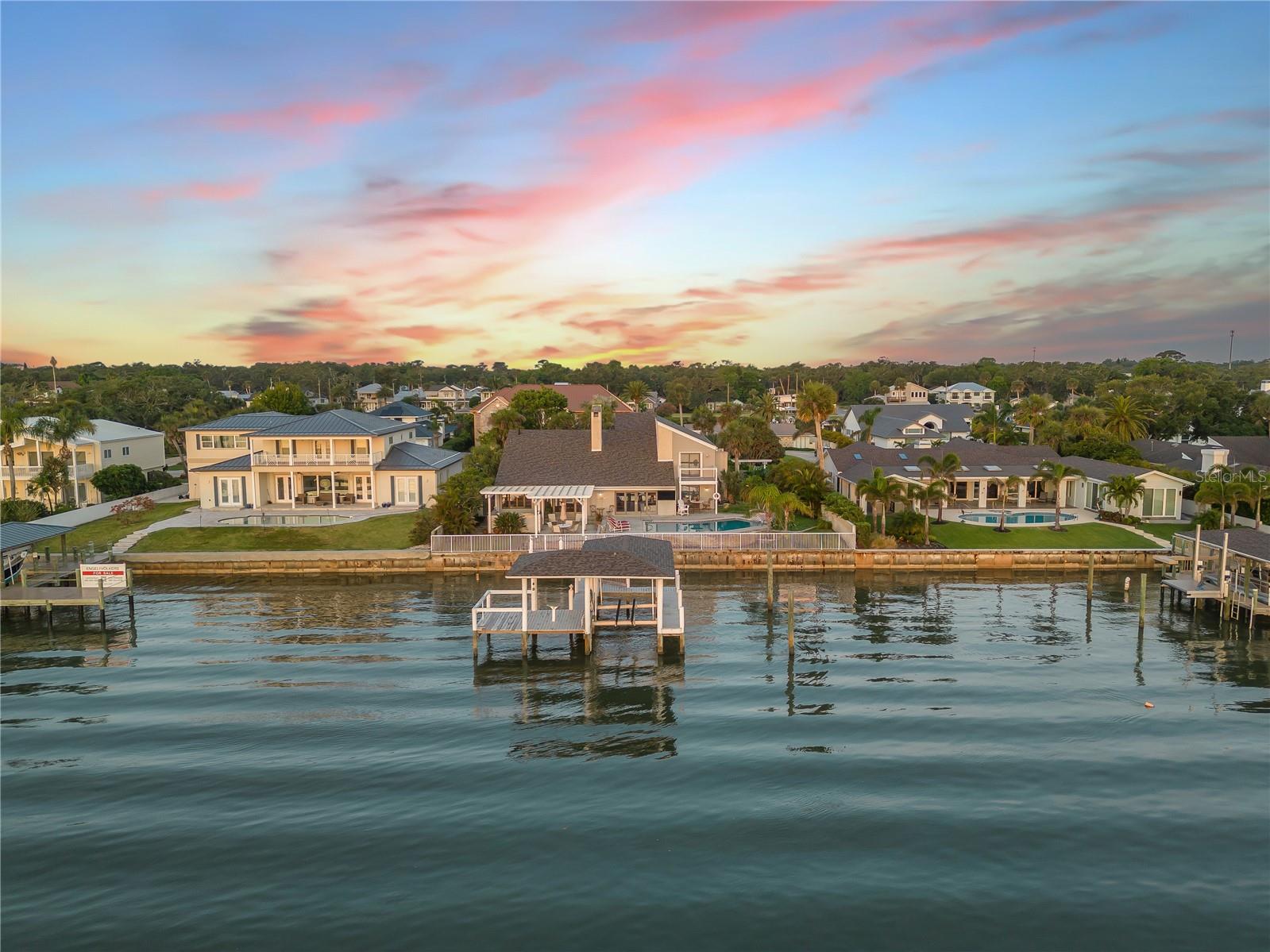 Discover a rare opportunity to own a pool home with a detached in-law suite apartment in Yacht Club Island, New Smyrna Beach’s only Intracoastal gated community. This property combines privacy, security, and resort-style living in one of the most exclusive neighborhoods on the East Coast of Florida. The main residence features a spacious layout designed for both relaxation and entertaining, while the private guest apartment is perfect for extended family, or visitors.
Enjoy your own backyard oasis with a sparkling pool and plenty of outdoor living space, ideal for the Florida lifestyle. Located just minutes from the Downtown New Smyrna Beach district, this home offers the convenience of golf cart access to local restaurants, shops, and the vibrant coastal scene. Residents appreciate the perfect balance of seclusion and connection—tucked inside a quiet, gated enclave along the Intracoastal Waterway while remaining close to beaches, marinas, and all the waterfront lifestyle anyone could ask for.
Priced to sell, this home presents an excellent opportunity for a buyer who appreciates the value of making updates and improvements to customize it to their own taste.
If you’ve been searching for a home that provides luxury, privacy, and versatile living space in an unbeatable location, this is the property that checks all the boxes. Don’t miss your chance to live in New Smyrna Beach’s premier Intracoastal community.