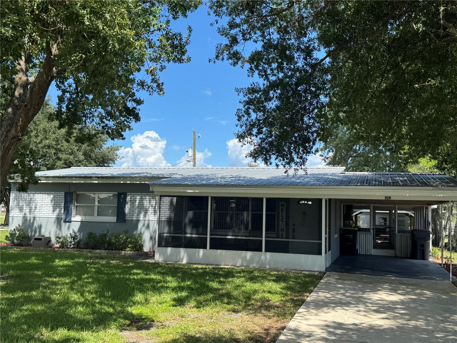 Welcome to this charming 2-bedroom, 2-bath concrete block home located in the established Sun Ray Subdivision of Frostproof. This well-maintained home features a covered carport, a functional floor plan, and low-maintenance block construction. Interior has been freshened up with new paint through out and updated flooring throughout. Rear Florida Room is enclosed and has a nice wall a/c unit. Could become a 3rd bedroom. Laundry room is spacious with new Front load washer and dryer units. Has a 3/4 shower, vanity and commode with a brand new hot water heater. Conveniently situated just minutes from US Highway 27, you'll enjoy easy access to shopping, schools, restaurants, and nearby Central Florida attractions while still appreciating the small-town atmosphere Frostproof has to offer. Whether you're looking for a starter home, seasonal residence, or investment property, this home offers an excellent opportunity at an affordable price.