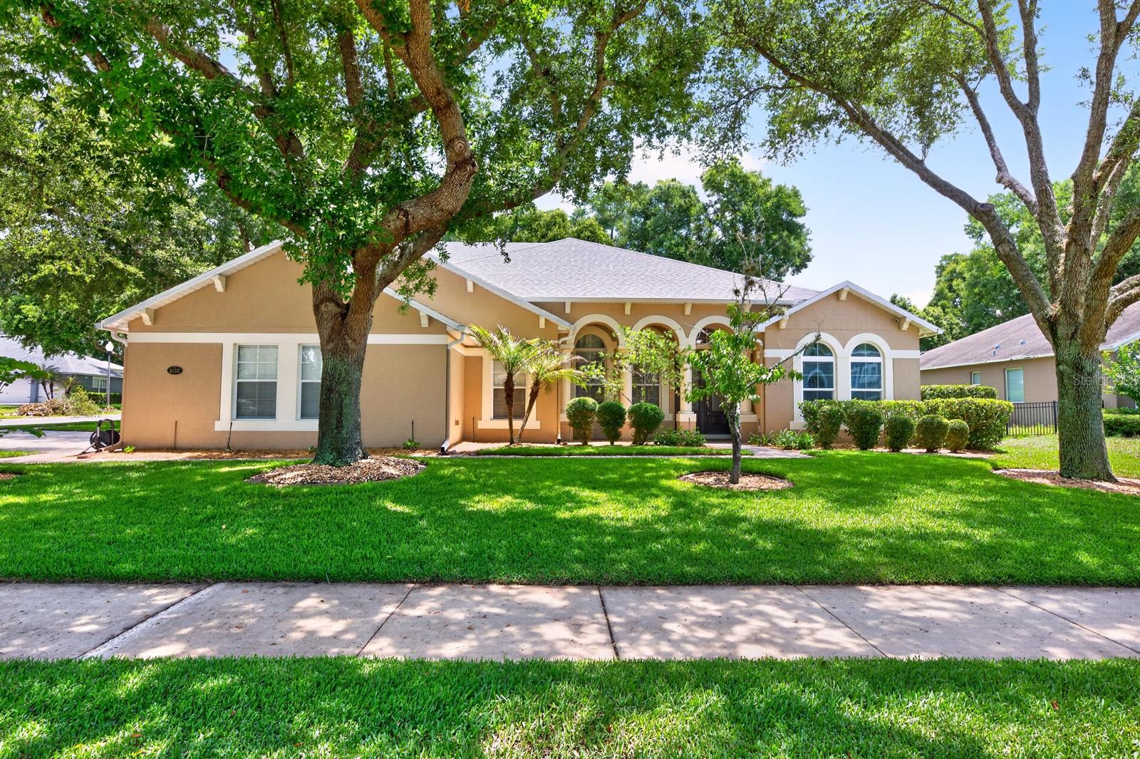 One or more photo(s) has been virtually staged. !! Welcome Home !! NEW ROOF (2024), FRESH EXTERIOR PAINT (2024), UPDATED WATER HEATER (2022), POOL SOLAR PANELS (2024), and packed with thoughtful upgrades throughout, this spacious POOL HOME in the GATED COMMUNITY of Wekiva Run is the kind of property that truly checks every box! Situated on a private .35 ACRE ~ CORNER LOT with mature trees and a partially fenced backyard, this 5-bedroom, 4-bath home delivers over-the-top functionality, versatile living space, and the ideal Florida lifestyle with most of the living space conveniently located on the first floor. Built for comfort and efficiency, the home features SOLID BLOCK construction with added insulation for impressive energy savings, rain gutters with gutter guards, an OWNED WATER SOFTENER, transferable termite bond, hardwired camera system with dedicated hard drive, 200 AMP electrical service, and a newer variable speed pool pump. MOVE-IN READY and designed with room to grow, every space has been carefully planned for both everyday living with family and entertaining friends. Stepping inside you will be delighted to find a formal dining area and a FLEX/OFFICE space at the front of the home, while the heart of the home opens into an expansive living area overlooking the large LANAI and private SCREENED POOL. The upgraded gourmet kitchen is a dream for any home chef, featuring DOUBLE ISLANDS for prep and gathering space, endless cabinetry topped with crown molding, sleek countertops, BUILT-IN DOUBLE OVENS, all new STAINLESS STEEL APPLIANCES, and a fun HIDDEN WALK-IN PANTRY seamlessly tucked away behind the cabinets. The casual dining nook enjoys tranquil pool views and sliding glass doors deliver an effortless indoor/outdoor flow. Your PRIMARY SUITE occupies its own wing of the home and features DUAL/WALK-IN CLOSETS along with a spacious en-suite bath designed for relaxation. Two secondary bedrooms share a Jack-and-Jill bath on the opposite side of the first floor, while a fourth bedroom sits near a full bath with direct pool access, creating the perfect guest or multi-generational setup. Upstairs expands the living possibilities even further with a HUGE GAMING LOFT, dedicated MEDIA/THEATER ROOM wired for 7.1 surround sound with projector included, plus a fifth bedroom with en-suite bath access ideal for guests, extended family, or a private retreat. Outside, enjoy your own backyard oasis complete with a custom 12,400-gallon screened SALT pool featuring a waterfall, LED color-changing lighting, paver decking, large covered lanai, and plenty of green space for pets, play, or entertaining in the Florida sunshine. Located in the gated community of Wekiva Run, residents enjoy 3 GATED ENTRANCES, a community park, a playground, a second green space, and a gazebo for neighborhood events, spacious homesites, and a welcoming atmosphere. Zoned for TOP-RATED SCHOOLS and conveniently located near SR-429, this home offers easy access to Orlando, Sanford, shopping, dining, area attractions, and Disney Parks while still enjoying the peaceful charm of Apopka living. Call today to schedule a tour and fall in love with Parkside Meadow Drive!