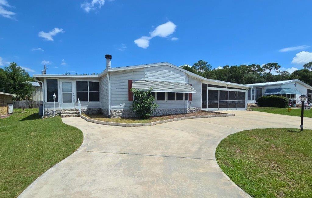 Welcome home to Traders Cove, a sought-after 55+ waterfront community offering a relaxed lifestyle with exceptional amenities and scenic river access. This spacious 2 bedroom, 2 bathroom residence offers approximately 1,959 square feet of living space, including a versatile bonus Florida room ideal for a game room, den, home office, fitness area, or additional entertaining space. Designed with comfort and functionality in mind, the home features an open-concept layout with a large living area centered around a cozy wood-burning fireplace, creating the perfect gathering space. The oversized kitchen boasts a large island, abundant cabinetry, and ample counter space for cooking and entertaining. Both bedrooms are generously sized, including a private primary suite with its own en-suite bath for added comfort and privacy. Step outside and enjoy all that Traders Cove has to offer, including a sparkling community pool, clubhouse, for enjoying the Florida outdoors. Conveniently located near shopping, dining, entertainment, and major highways, this home combines peaceful community living with easy access to everything you need. All information recorded in the MLS is intended to be accurate but cannot be guaranteed, buyer advised to verify.
