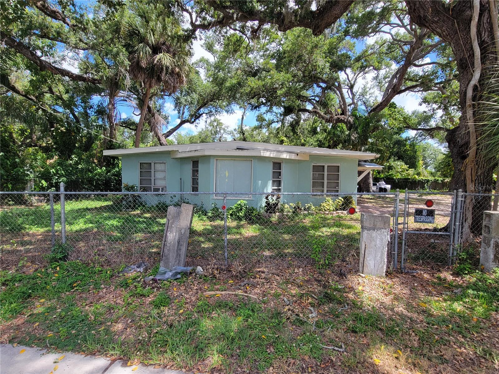 RARE DOUBLE-LOT OPPORTUNITY IN SARASOTA! This spacious 5-bedroom, 2.5-bath home is situated on two separately parceled lots totaling 15,670 square feet, offering a unique combination of comfortable living today and exciting future possibilities tomorrow.

The property is fully fenced with a gated driveway entrance, creating a private setting enhanced by mature shade trees and generous outdoor space. Inside, you'll find tile flooring throughout, flexible living areas, and plenty of room for a large family, multigenerational living, rental opportunities, or home office space. The oversized 450-square-foot two-car garage includes washer and dryer connections and provides ample room for vehicles, storage, or workshop space.

Conveniently located near Ringling College of Art & Design, New College of Florida, downtown Sarasota, shopping, dining, and Gulf Coast beaches, this property offers both location and potential.

A unique feature of this offering is the adjacent separately parceled lot. Sarasota County has indicated the parcel is buildable; however, buyers should independently verify all development potential, lot configuration requirements, boundary considerations, and approval requirements with Sarasota County and the City of Sarasota. Potential future uses may include expansion of the existing homesite, an accessory dwelling unit (ADU), or construction of an additional residence, subject to governmental approvals.

Opportunities to acquire a home with this much land, privacy, and future development potential in Sarasota are increasingly rare.  EZ Show and SELL.