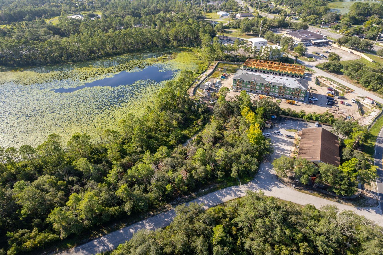 BUILDABLE VACANT LAND on .50 Acre Parcel in Deltona Lakes off Howland Blvd Zoned RM1 (Residential and Multi-Family) is ready for your NEW Single-Family Home or Multi-Family Build like a Duplex or Apartments. This Lot features a Water View and provides the privacy that you need while giving you the land to be creative with your investment needs. This vacant lot can give you the best of both worlds - country and urban life as it's located in a residential area near the bus stop and close to many shops and grocery stores like Publix, Lowe's, AutoZone, McDonald's, CVS and more! Perfect investment of land that is ready for you to build. Buy and build today!