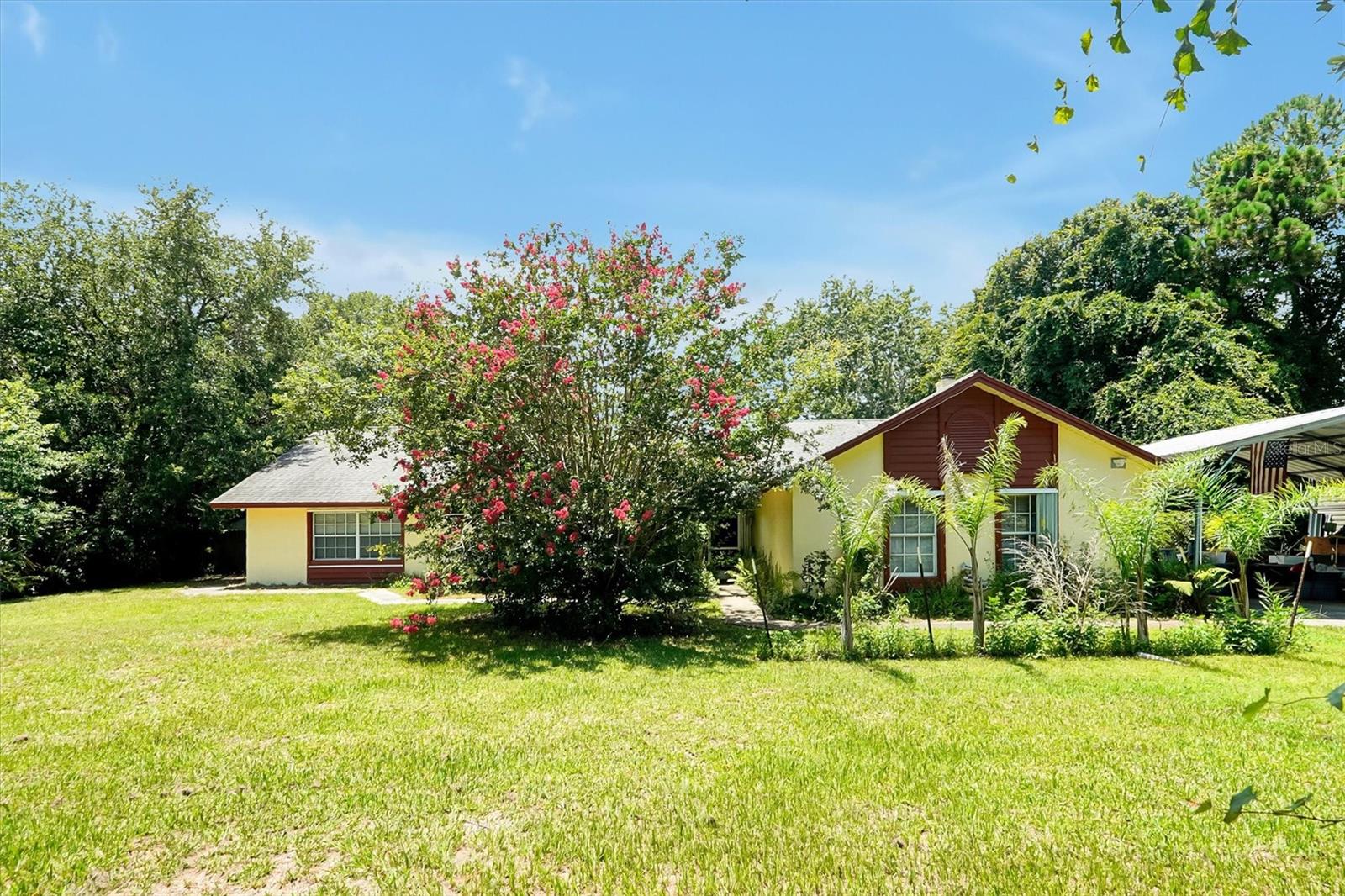 Welcome to this massive 4-bedroom, 4-bathroom property in Mims! This unique home offers a versatile layout with an attached apartment, making it perfect for extended family, guests, or flexible living arrangements. Inside, you'll find a cozy fireplace, stainless steel appliances, including a ZLINE gas range, two gas water heaters, and an LG front-load steam washer and dryer. According to the seller, the Timberline roof was replaced in (2018). The property also features an upgraded well system with an ozone sanitizer and ion exchange system, as well as two septic tanks that were last serviced approximately five years ago. Don't miss this opportunity to own a home with flexible living space and valuable upgrades!