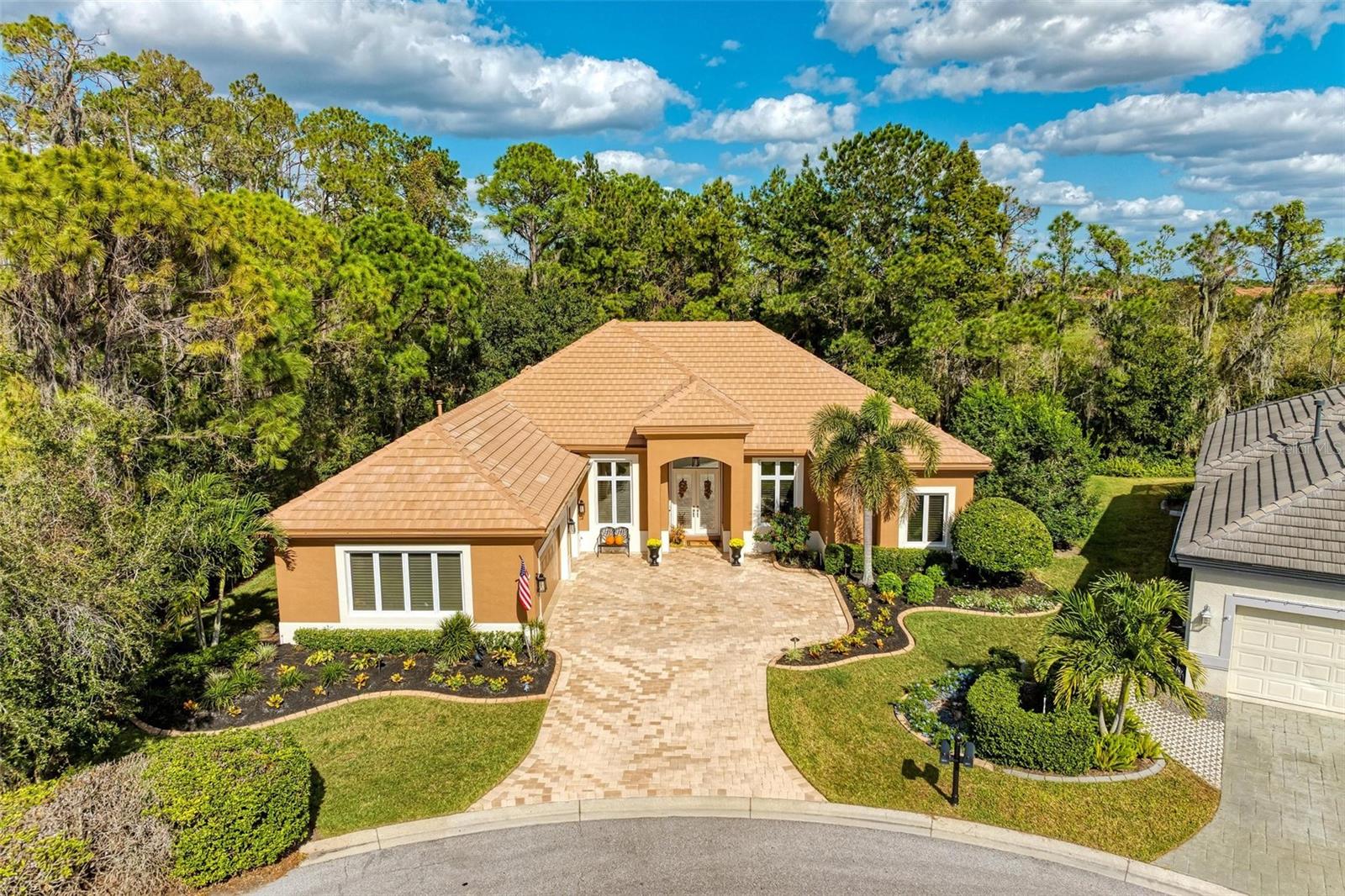 A Touch of Class…this star-studded home delivers! A rare opportunity to own a home within the elite enclave of the North Bridge subcommunity in Rosedale Golf & Country Club. This gorgeous 3 bedroom, 3 full bath, 2,573 sq. ft. home has it all! Situated on a private ½ acre preserve lot. The Sterling great room floor plan offers luxurious Florida living with a formal dining room, separate office/den, completely remodeled gourmet kitchen with café eat-in space, each bedroom with its very own ensuite bath. Impressive, high-quality improvements have been completed. They include New Roof 2023, New A/C 2021 w/transferable warranty, New Hot Water Heater 2019, Whole house water filtration R/O system, Complete Kitchen, and Bathroom remodels! High-end appliances and wine bar, new designer lighting, chandeliers, fans throughout, custom made draperies in most rooms, installed new wood flooring, freshly painted interior, exterior paint 2023, 2021 newly installed outdoor expanded lanai w/picture frame enclosure, new paver brick flooring with comfortable heaters and fans. The outdoor landscape has completely transformed with decorative curbing, accent and up lighting throughout the entire yard and gardens, magnificent water fountain, new backyard fencing with a mosquito misting system in place. The 2+ oversized garage with golf cart space has additional built-in storage cabinetry, new epoxy flooring and workspace. There is So Much More to Mention about this special home, this is a Truly Must See! Whether you're seeking an active or a more relaxed environment, Rosedale has something to offer each member of its community. With the appealing Social Membership to the Rosedale Golf & Country Club, you can enjoy amenities such as lighted Har-Tru tennis courts, bocce courts, and a 22,000 square foot clubhouse with a heated junior-size Olympic swimming pool, the recently upgraded fitness center features Peloton Bikes and mirror exercise equipment, daily workout classes and access to personal trainers. The Clubhouse features a full-service restaurant that hosts numerous social events and activities throughout the year. For the avid golfer, Rosedale Golf and Country Club offers various levels of golf memberships. HOA fees conveniently include cable & internet, landscaping, 24/7 manned gates, and dog parks. Rosedale is a meticulously maintained community conveniently located just east of I-75 between SR-70 and SR-64 centrally located to restaurants, UTC mall, the airport, great schools, and some of the best beaches in the country! Call for your preview today, this one will not last! P.S. No Mandatory Membership here and No CDD Fees!