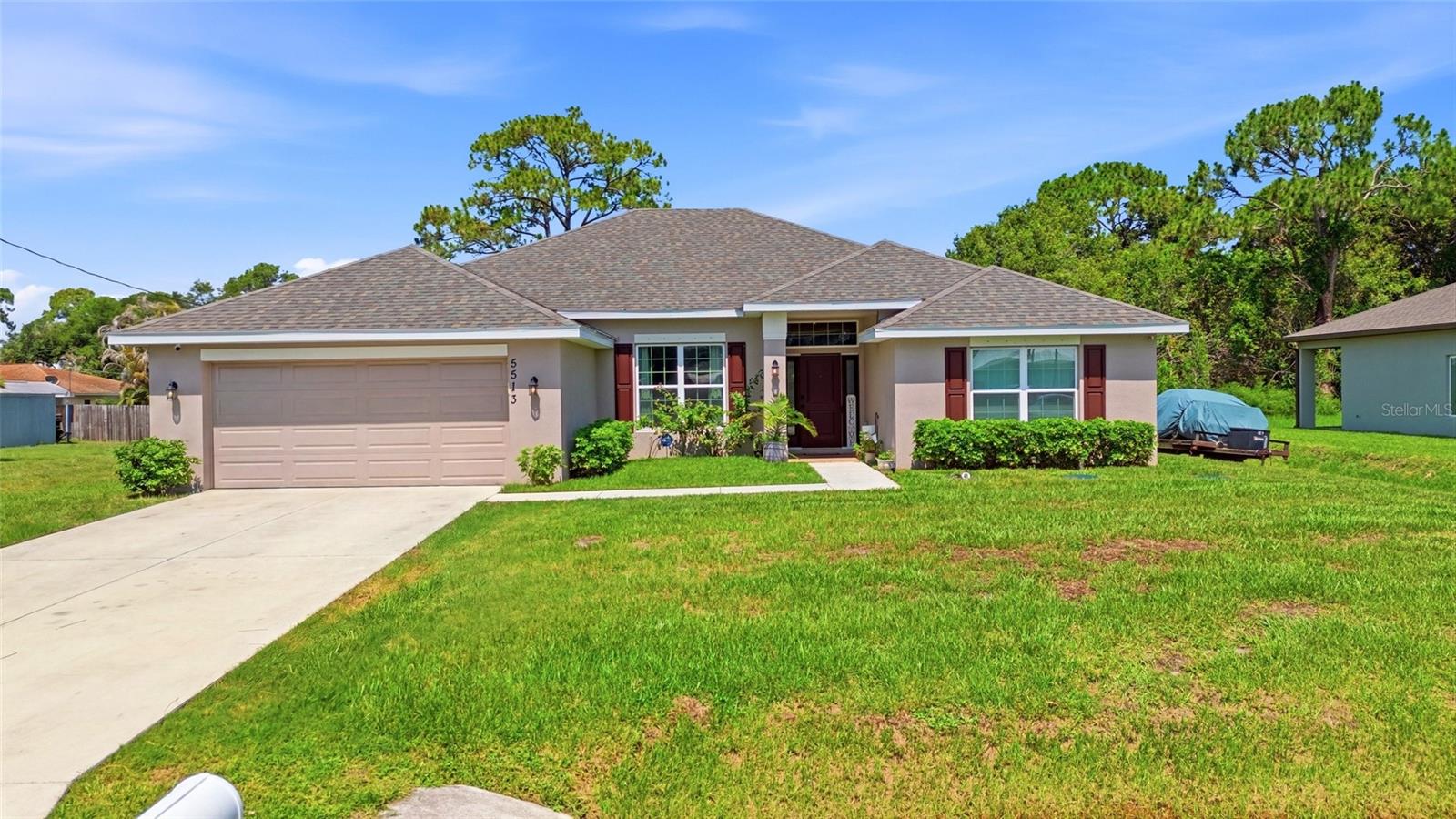 Beautiful newer construction home located in the desirable Indian River Estates area of Fort Pierce! Built in 2022, this spacious 4-bedroom, 2-bath residence offers an open and split-bedroom floor plan filled with natural light and designed for comfortable everyday living. The kitchen features stainless steel appliances, raised-panel wood cabinetry, ample counter space, and opens seamlessly to the oversized family room—perfect for entertaining. Enjoy relaxing mornings or evenings on the large covered and screened patio overlooking the expansive backyard with plenty of room for a pool, fire pit, playground, or outdoor oasis. Generously sized bedrooms provide plenty of closet space, while the 2-car garage adds extra storage and convenience. Located close to beaches, shopping, dining, schools, and major roadways with no HOA restrictions. A fantastic opportunity to own a move-in-ready home in a growing area of Fort Pierce! Buyer to perform their own due diligence and verify all measurements, property details, and information deemed important.