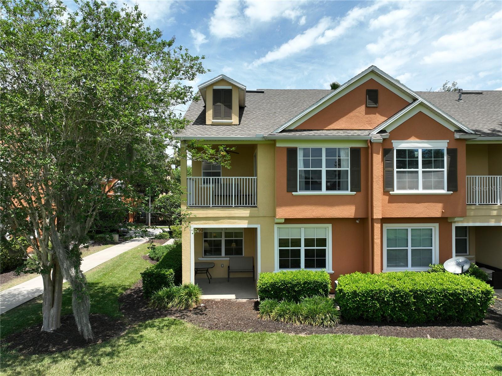 Discover this striking TURN-KEY 1862-square-foot townhome at Carriage Pointe in the Reunion Resort. This home is a UNIQUELY POSITIONED CORNER/END UNIT AND IS DIRECTLY ON THE GOLF COURSE with an unobstructed straight on view of notable HOLE 17 of the Independence Golf Course designed by Tom Watson. Welcome to your private GATED COMMUNITY that blends modern comfort with resort-style living. This two-story CORNER UNIT features 4 bedrooms and 2.5 baths, including a COVENIENT FIRST FLOOR BEDROOM. The high ceiling layout showcases CEILING SURROUND SOUND BUILT IN SPEAKERS, STAINLESS STEEL GAS APPLIANCES in a chef-ready kitchen, while upgraded furniture with modern finishes create an inviting place to call home. Enjoy sunlit moments on a second balcony that is right off the primary suite overlooking the golf course. This townhome sits just across the street from the COMMUNITY POOL. Short term rentals are allowed, providing the option as a primary residence or vacation investment. With STRONG BOOKING HISTORY, this fully furnished unit is a GREAT INVESTMENT OPPORTUNITY, ideal for easy maintenance and steady income in Reunion Florida. Ownership here means access to three championship golf courses designed by Arnold Palmer, Tom Watson, and Jack Nicklaus; multiple resort pools; a multi-acre water park with lazy river and slides; tennis and pickleball courts; fitness center; full-service spa; and award-winning restaurants. The home is located within very close proximity to Walt Disney World, shopping/restaurants, and multiple major highways. HOA includes cable, high speed internet, landscaping, community pool, and more. -MUST SEE IN PERSON- Contact your agent today to see for yourself how nice this unit really is! *SHOWINGS ARE BY APPOINTMENT ONLY*