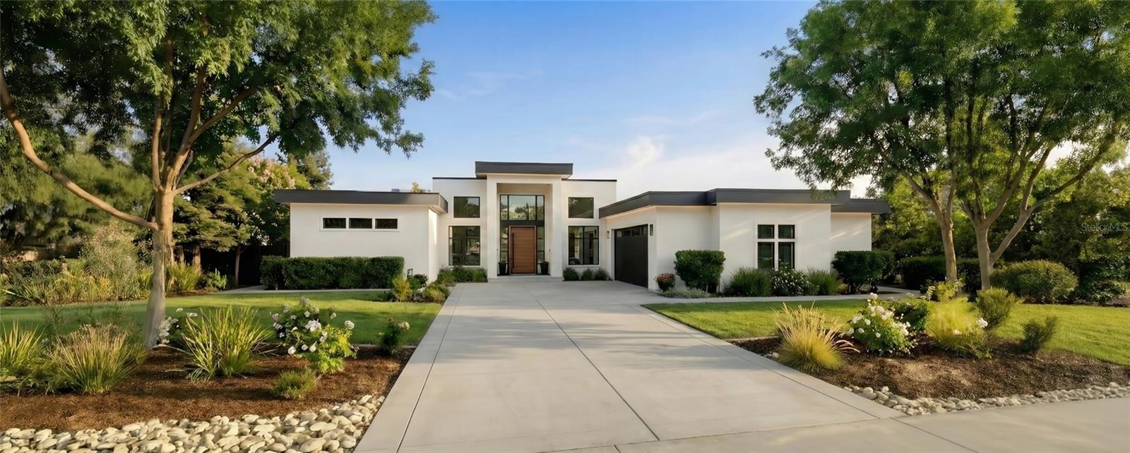 Pre-Construction. To be built. Lakefront Home! Presenting; The Hampton by Trilogy Homes, an architecturally refined lakefront residence designed for elevated everyday living within an exclusive gated luxury home community. Perfectly positioned on Lot 9 a premier homesite offering approximately 82 feet of direct lake frontage, this property enjoys serene water views, enhanced privacy, and a rare connection to natural beauty—creating an extraordinary setting for a custom home of distinction.

Thoughtfully composed and spanning 4,450 sq ft of conditioned living space (over 7,100 sq ft total), The Hampton blends architectural presence with warmth, comfort, and intentional design. Layered natural light, balanced proportions, and seamless indoor–outdoor transitions create a residence that feels both elegant and effortless. The main floor features the primary suite, a grand great room, designer kitchen with an expansive island and walk-in pantry, dedicated dining room, two additional bedrooms, a full bath, powder room, laundry room, and an oversized garage. Covered and uncovered balcony spaces extend the living experience outdoors, capturing elevated lake views and providing exceptional space for relaxation or entertainment.

The lakefront lower level includes two additional bedrooms and a full bath, a powder bath, and a spacious secondary living room with a built-in wet bar—ideal for gatherings, hosting guests, or multigenerational living. Multiple lanai areas provide direct access to the lakeside environment and future poolside living opportunities. A substantial unairconditioned shop and expansive storage areas add meaningful flexibility for hobbies, recreation, or specialty storage needs. Designed with adaptability in mind, Trilogy Homes offers opportunities to personalize The Hampton while maintaining its timeless architectural integrity.

Situated within Mirror Lake, an intimate gated community of just 21 homesites, residents enjoy an uncommon pairing of lakefront serenity and wide-open golf course vistas from the adjacent Clermont National Golf Course. The setting offers privacy, exclusivity, and a lifestyle defined by natural beauty and homes with architectural distinction. This exceptional lot and custom designed home present a rare opportunity to build a luxury residence in one of Central Florida’s most captivating lakefront enclaves, offering privacy, exclusivity, and a thoughtful architectural vision. More than a place to live, Mirror Lake is a retreat for those who appreciate distinction, natural beauty, and a lifestyle designed with intention and differentiation. Close to all things but miles away in Lifestyle, this unique homesite is one of the most captivating sites in Mirror Lake—offering a timeless setting and an extraordinary canvas for your custom home. Call us to reserve this extraordinary lot while you meet with Trilogy Homes to explore this home design further and take next steps to making Mirror Lake your “Dream Home Come True!" There may be additional design fees from the Builder if the offered Home design is materially changed by Buyer.