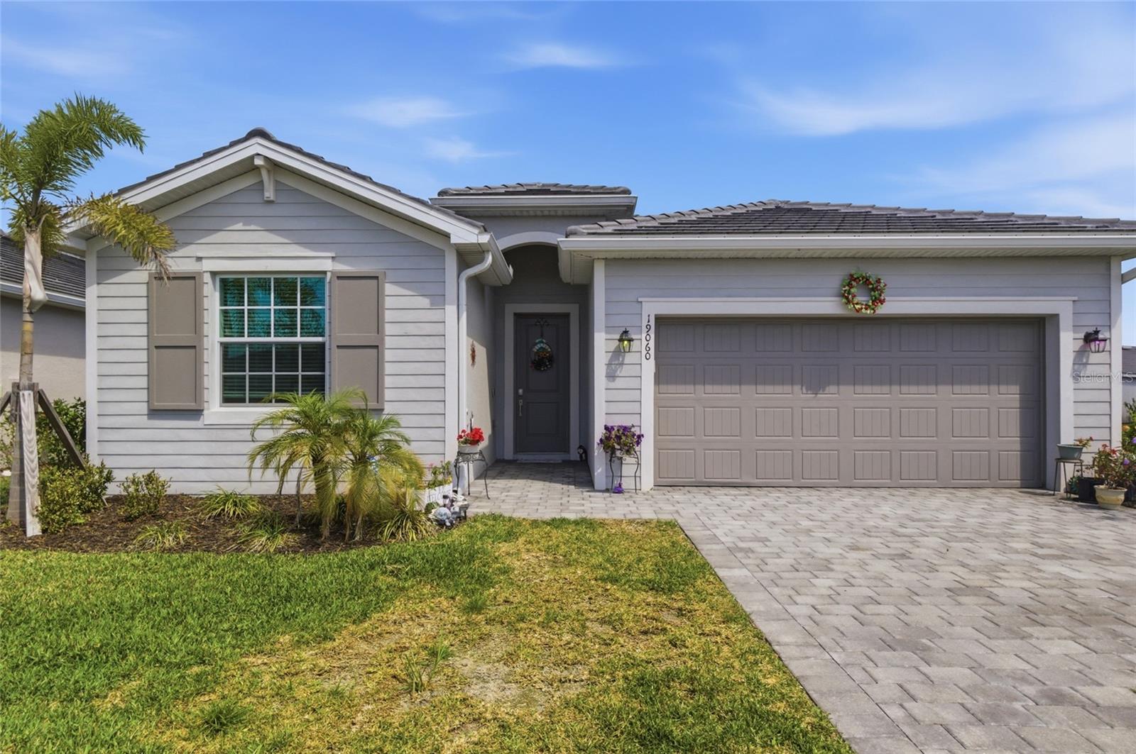Nestled in the desirable Antigua neighborhood of Wellen Park, this stunning 4-bedroom, 3-bathroom home offers the perfect blend of space, style, and comfort. Situated on a generous corner lot, the property boasts exceptional curb appeal and a sense of privacy. Step inside to discover a bright and airy open floor plan, ideal for both family living and entertaining.
The heart of the home is the expansive living area, seamlessly flowing into a modern kitchen with stainless steel appliances, ample counter space, and a large island perfect for gathering. The adjacent dining area offers a picturesque view of the lush backyard. The primary suite is a true retreat, featuring a spacious bedroom, a walk-in closet, and a luxurious en-suite bathroom with dual sinks and a separate shower.
Three additional bedrooms provide plenty of space for family, guests, or a home office. Enjoy the Florida lifestyle with an outdoor living area, perfect for barbecues and relaxation. With its prime location, thoughtful design, this home is just minutes to downtown Wellen Park and Atlanta Braves Cool Today Park. Schedule your showing today!