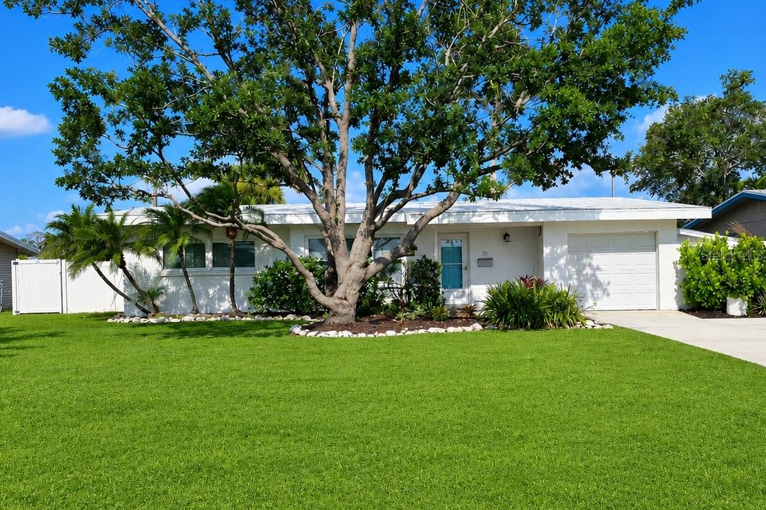 Welcome to this FURNISHED and beautifully updated 2-bedroom, 1.5-bath POOL HOME on a private completely fenced lot located minutes from Downtown Bradenton and the Manatee River. Every detail has been thoughtfully designed to create the perfect blend of modern comfort and Florida living.

Step inside to discover soaring vaulted ceilings with exposed beams, fresh interior paint, new luxury vinyl plank flooring throughout, and an open-concept floor plan filled with natural light. The stunning kitchen serves as the heart of the home, featuring new solid wood cabinetry, quartz countertops, stainless steel appliances, a large center island, and designer finishes that make entertaining effortless.

The renovated bathroom showcases elegant tile work and contemporary fixtures, while the spacious bedrooms provide a relaxing retreat. An inside laundry room adds everyday convenience.

Outside is where this home truly shines. Enjoy your own private oasis with a newly resurfaced, heated screened swimming pool surrounded by a spacious covered lanai, creating the perfect space for year-round entertaining, relaxing, or enjoying Florida's beautiful weather. The fully fenced backyard offers privacy and room for pets or gardening.

Additional upgrades include a NEW ROOF (2021), hurricane IMPACT WINDOWS throughout most of the home, NEW POOL HEATER, and mature tropical landscaping that enhances the home's curb appeal.

Ideally located just minutes from Downtown Bradenton, the scenic Bradenton Riverwalk, public boat ramps with access to the Manatee River, waterfront dining, shopping, and Gulf Coast beaches, this move-in-ready home offers the perfect combination of comfort, style, and location. Nearby outdoor recreation includes the Bradenton Riverwalk, parks, fishing, boating, and easy access to Anna Maria Island and other Gulf Coast attractions.

Whether you're searching for a full-time residence, seasonal retreat, or investment opportunity, this beautifully renovated pool home is one you won't want to miss.