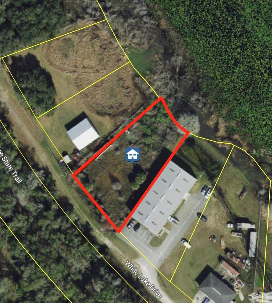Build your next project on this 0.52-acre industrial lot with lake frontage in Inverness. Zoned IM (Industrial/Manufacturing), this site offers flexible options for warehouse, storage, or light industrial uses while enjoying a quiet setting away from the highway noise. The property sits in the Grants Lakeside Addition area with easy access to Hwy 41 and nearby Inverness amenities, services, and workforce. No existing structures to remove and no HOA, giving you a clean slate for your plans. Buyer to verify all zoning, allowable uses, utilities, and any environmental or engineering requirements to their satisfaction.