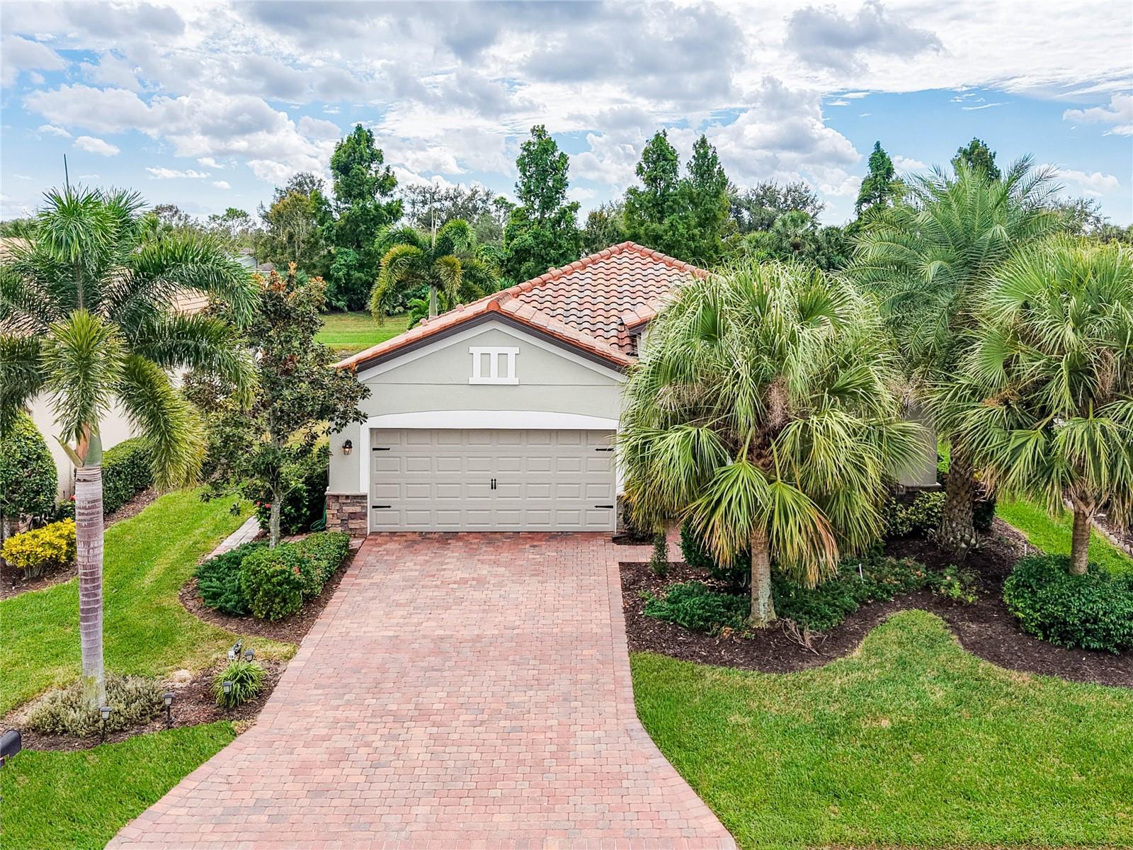 WHAT’S SPECIAL
QUIET STREET - SERENE & SCENIC WATER/POND VIEW – GIANT SCREENED LANAI WITH HOT TUB - ENSUITE DESIGNER TILED BATH WITH SHOWER TOWER & SEATED BATHING -- HUGE KITCHEN – BUILT-IN MURPHY BED IN GUEST BEDROOM -- SCREENED ENTRY WAY.
NOT TOO BIG, NOT TOO SMALL, JUST RIGHT!!  AFFORDABLE COMFORT & LUXURY.  

Great as primary residence or investment property; attractive for seasonal renters.  Pristine, lightly used, lovingly maintained, home on cul-de-sac, with southern exposure, panoramic water and greenery views.  0pen living design with ceramic tile floor in foyer, living, dining, kitchen, laundry room & hallways; wood floor throughout 3 bedrooms; great outdoor living for family fun and friends on huge lanai with spa/hot tub. (A home pool can be nice, but since this home is just a 5 minute walk to two clubhouses with resort pools, we opted for a spa/hot tub, which is great for sore muscles, socializing and relaxation any time.)

MANY UPGRADES including: 600 sq ft (30ft x 20 ft) “no-see-um” screened lanai with panoramic screen added to existing 128 sq ft covered lanai; 150 sq ft unscreened patio for fire pit & sun bathe; engineered hardwood floors in all three bedrooms; new smart LG kitchen appliances; upgraded bathroom fixtures and lighting; new epoxy garage floor; extensive customized landscaping; recently painted house exterior and garage interior; roof and driveway power washed; driveway sealed; front entry screened & covered.  Master bedroom with en-suite bathroom and designer tiled glassed-in sitting and standing showers with sturdy handholds, multi-spray shower tower, wheelchair accessible. Beautiful backyard and landscaping with Christmas palms, Pygmy palms, Foxtail palms, flower beds and shrubs; Samsung washer and dryer; two-car garage with custom shelving, new epoxy garage floor; paver driveway with room for parking two cars.  The home weathered Hurricanes Milton and Helene in 2024 with no damage and no flooding. Low HOA fees include basic landscaping, internet, cable & TV; Selling furnished or unfurnished.  

This home is located in beautifully designed and landscaped golf & tennis country club with extensive natural wetlands, walking distance to main clubhouse with bars and restaurants, resort swimming pool, resistance pool, gym, library, golf pro shop, driving range, 27-hole golf course; tennis center with 9 har-tru courts and pro shops. Also walking distance to satellite clubhouse with 8 pickleball courts, function room, swimming pool & hot tub.  Fabulous amenity renovation to be completed in early 2026 ($8+ million assessment already paid.) Golf available WITHOUT golf mandatory dues.  Easy access to dining, shopping, Gulf beaches, fishing, Interstate 75 & airports in Sarasota and Tampa.

THIS HOME IS PERFECT FOR QUIET DAYS, FAMILY GATHERINGS & GREAT PARTIES. TAXES CAN BE LOWER IF YOU QUALIFY FOR HOMESTEAD EXEMPTION.