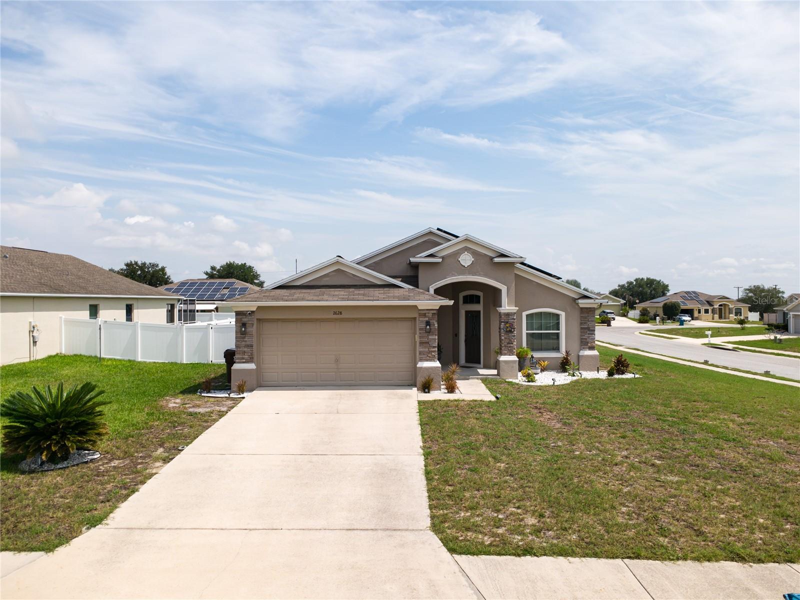 Welcome to your future home situated on a desirable corner lot in Lake Wales. Featuring a spacious floor plan, a two-car garage, PAID OFF solar panels for added energy efficiency, and a FULLY FENCED backyard, this property offers both comfort and convenience. Enjoy Florida living year-round from the large screened-in rear porch overlooking the backyard and private gazebo perfect for relaxing or entertaining guests. Ideally located near shopping centers, supermarkets, restaurants, schools, parks, and major roadways, you'll have easy access to everything you need while enjoying a quiet residential setting. Whether you're commuting, working from home, or simply looking for extra outdoor space, this home checks all the boxes. Schedule your private showing today.