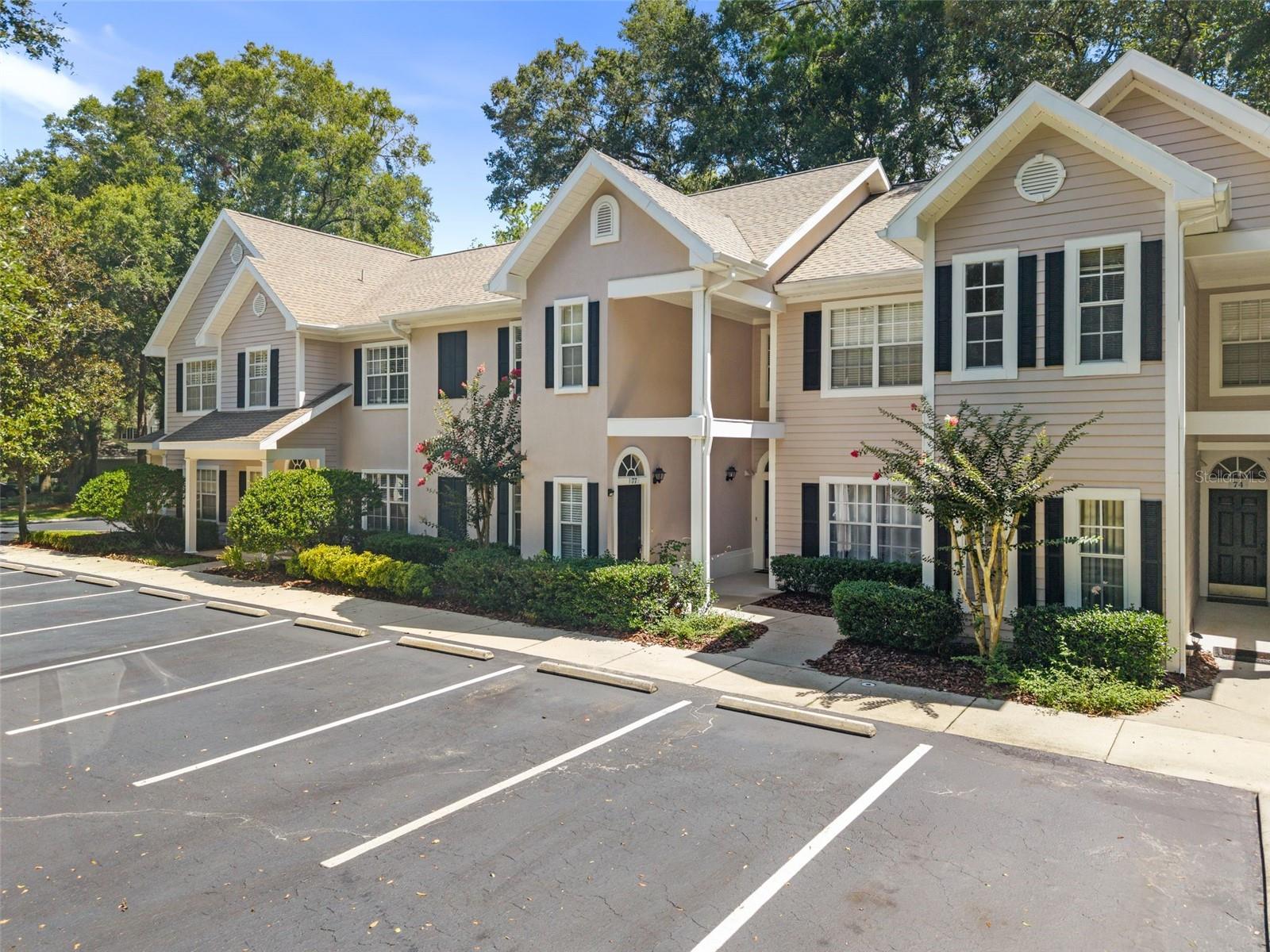 Enjoy the perfect combination of convenience, resort-style amenities, and the natural beauty that make Haile Plantation one of Gainesville's most sought-after communities. Nestled within The Links at Haile Plantation, this beautifully maintained 3-bedroom, 2-bath second-floor condo offers 1,454 square feet of thoughtfully designed living space and the largest floor plan available in the community. Featuring soaring vaulted ceilings, beautiful bamboo flooring, and a desirable split-bedroom layout, this home offers the perfect balance of spaciousness, comfort, and functionality.

Residents of The Links enjoy exclusive access to a private swimming pool, fitness center, and clubhouse. Memberships are available at nearby Hawkstone Country Club, featuring an 18-hole championship golf course designed by Gary Player, tennis and pickleball courts, two swimming pools, a state-of-the-art fitness center, exceptional dining, and an active social calendar.

Inside, the open-concept layout is filled with natural light and designed for comfortable everyday living and effortless entertaining. The kitchen features brand-new stainless steel appliances, a pantry, breakfast bar, and overlooks the main living space. A built-in office nook provides the perfect space for working remotely or studying, while a newer water heater offers added peace of mind.

The spacious primary suite features a large walk-in closet and an updated ensuite bathroom with dual vanities, new sinks, and updated fixtures. Two additional bedrooms feature oversized closets and share a beautifully updated guest bathroom. Additional conveniences include abundant guest parking and designated boat and RV parking.

One of this home's standout features is its private balcony overlooking the Haile Plantation Urban Ecology Trail. Backing directly to wooded green space, this peaceful retreat offers scenic nature views and immediate access to more than 7.5 miles of walking, running, and biking trails, creating a level of privacy and tranquility rarely found in condominium living.

Less than 1.5 miles from Haile Village Center, you'll enjoy local restaurants, boutiques, coffee shops, and the popular weekly Farmers Market. Conveniently located near Celebration Pointe, Butler Plaza, UF Health Shands Hospital, the University of Florida, and I-75, everything Gainesville has is just minutes away.

Offering the largest floor plan in The Links, outstanding community amenities, and direct access to one of Gainesville's most scenic trail systems, this move-in-ready home is a rare opportunity to experience the very best of Haile Plantation living. Schedule your private showing today!