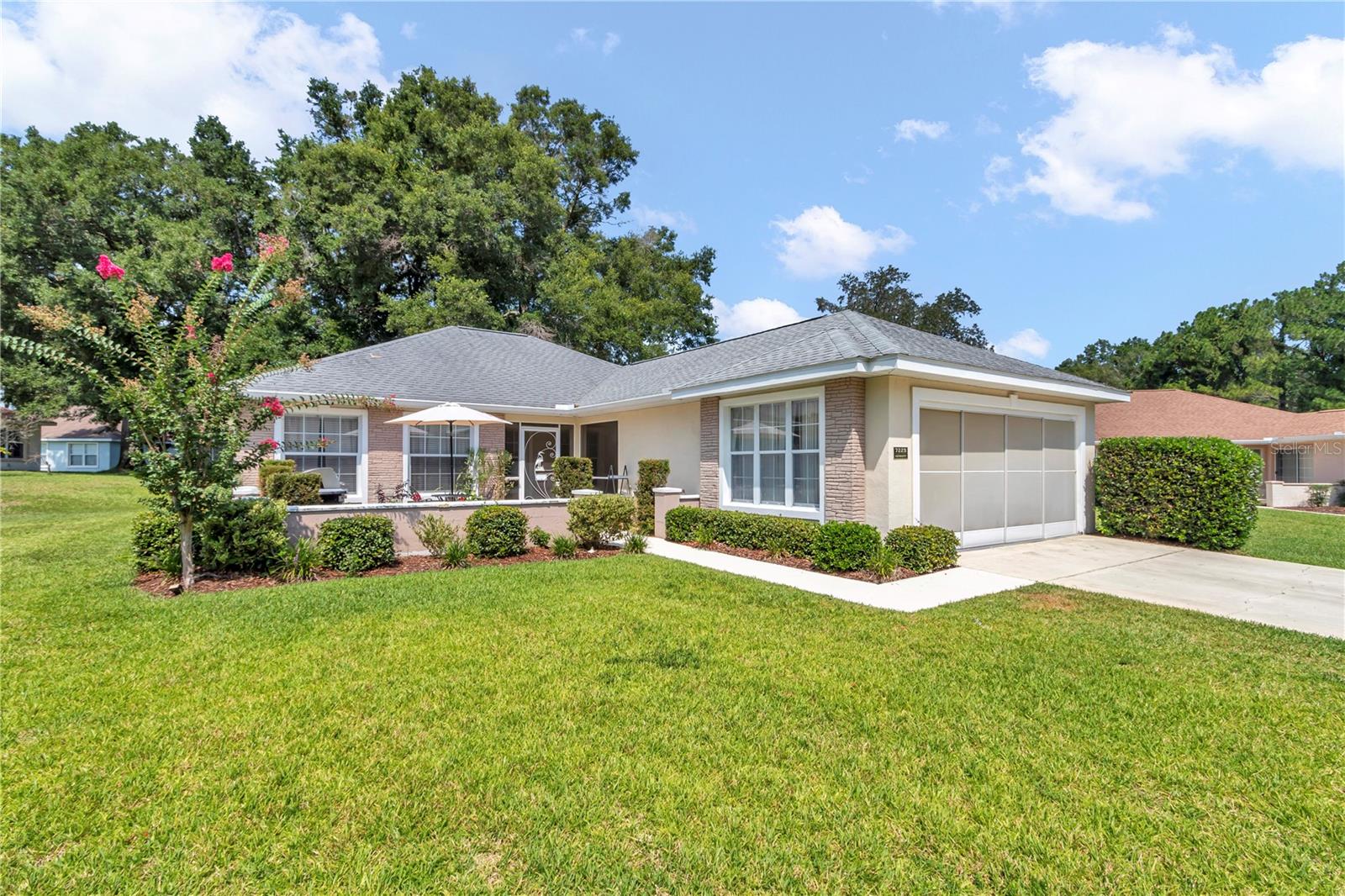 Welcome home to carefree living in Oak Run, one of Ocala's premier 55+ communities! This beautifully maintained updated block home is located in Hillside with a wonderful private lot location and features two spacious master suites, each with walk-in closets, 2.5 updated baths, and a 2-car garage. Enjoy stylish new luxury vinyl plank flooring, granite kitchen countertops, new appliances, updated bathrooms, new interior doors and hardware, fresh neutral paint throughout, and a roof replaced in 2017, HVAC replaced 2021. With approximately 1,476 square feet of comfortable living space and a fully maintained lawn included through the HOA, you'll have more time to enjoy Oak Run's outstanding amenities and active lifestyle. Simply move in and start enjoying retirement!